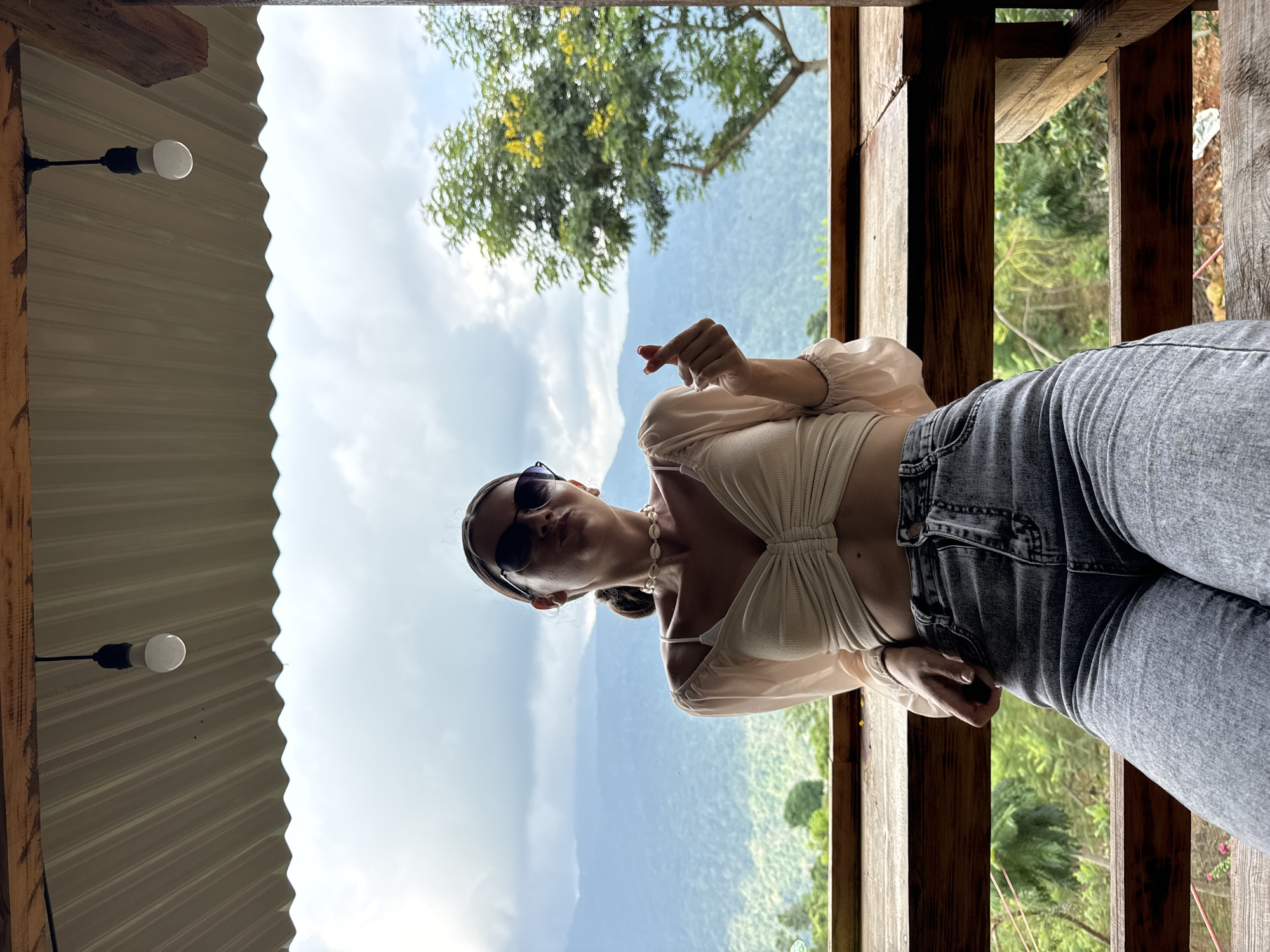 Woman enjoys morning photo session at Vietnamese mountain viewpoint