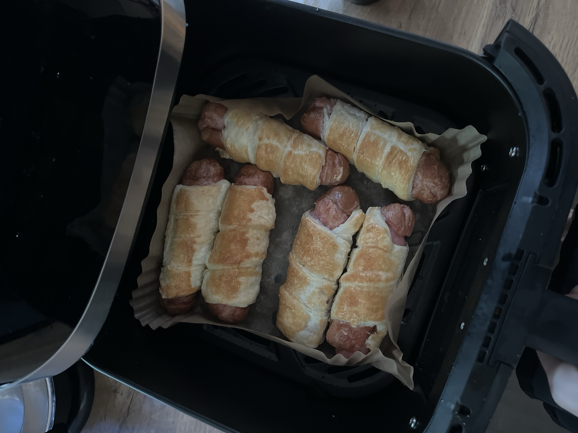 Saint Petersburg resident prepares wrapped hot dogs, spends time with cat