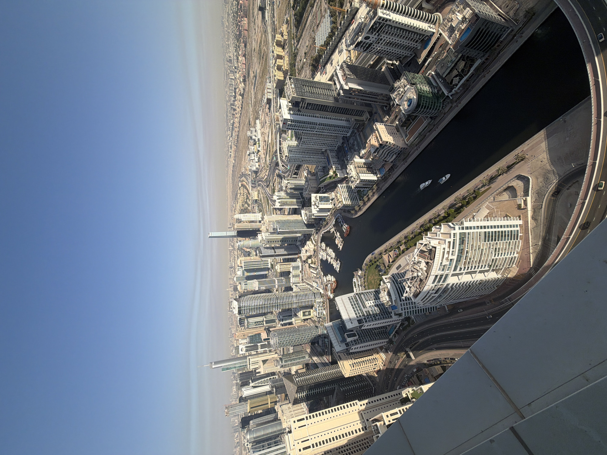 Yachts cruise Dubai canals in aerial footage