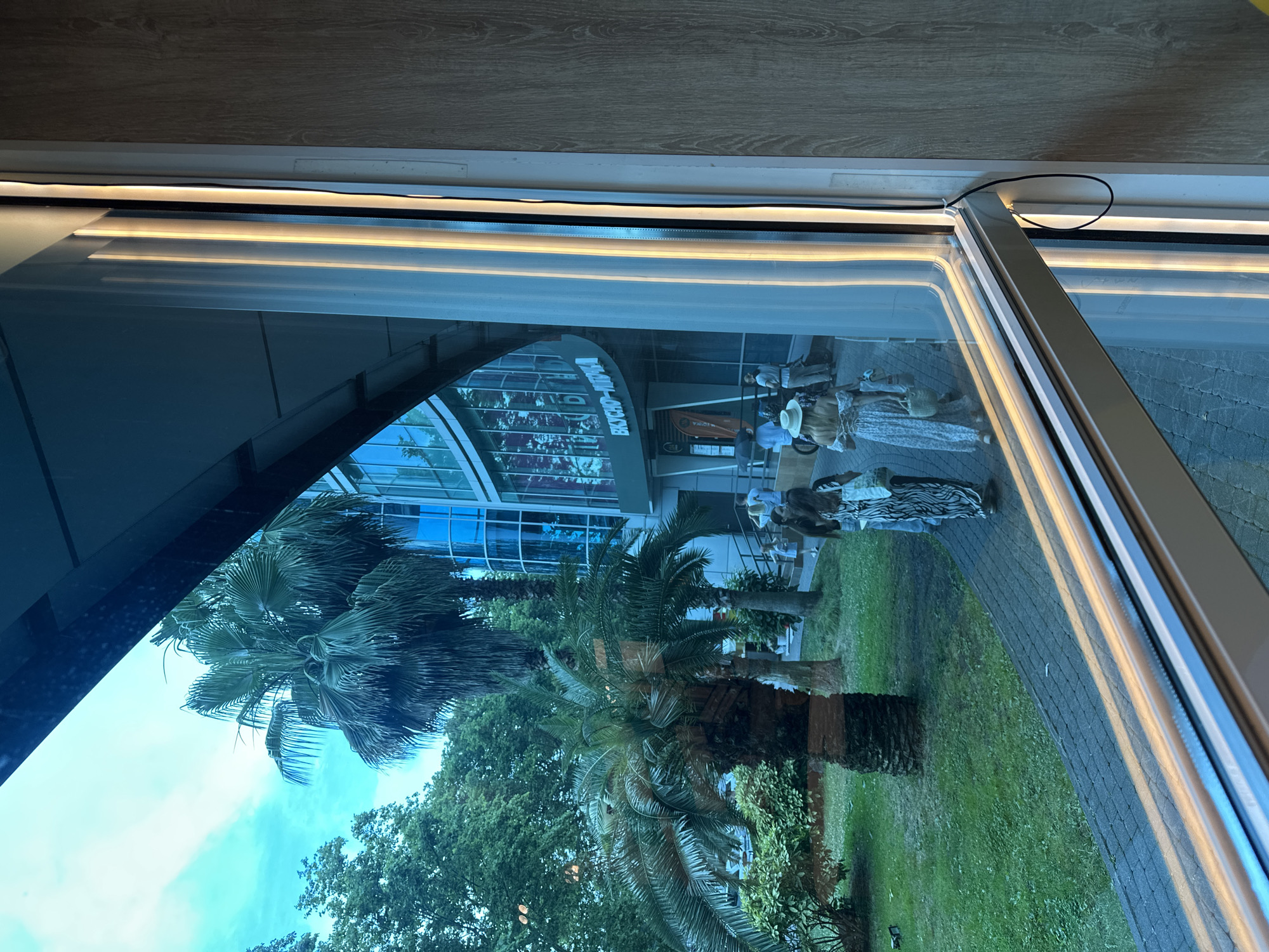 Lunch break at a Sochi McDonald's near a glass-facade landmark