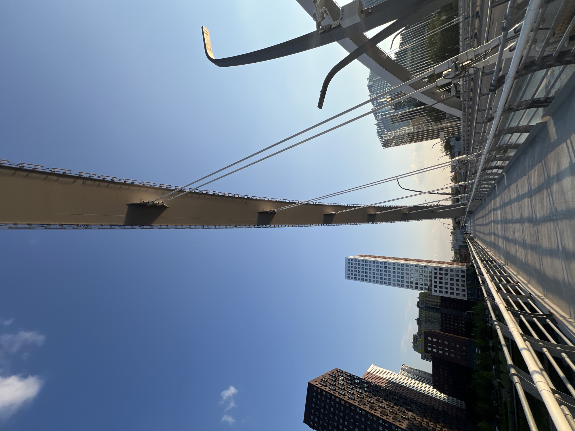 Urban skyline, metro stations, and industry on a clear afternoon