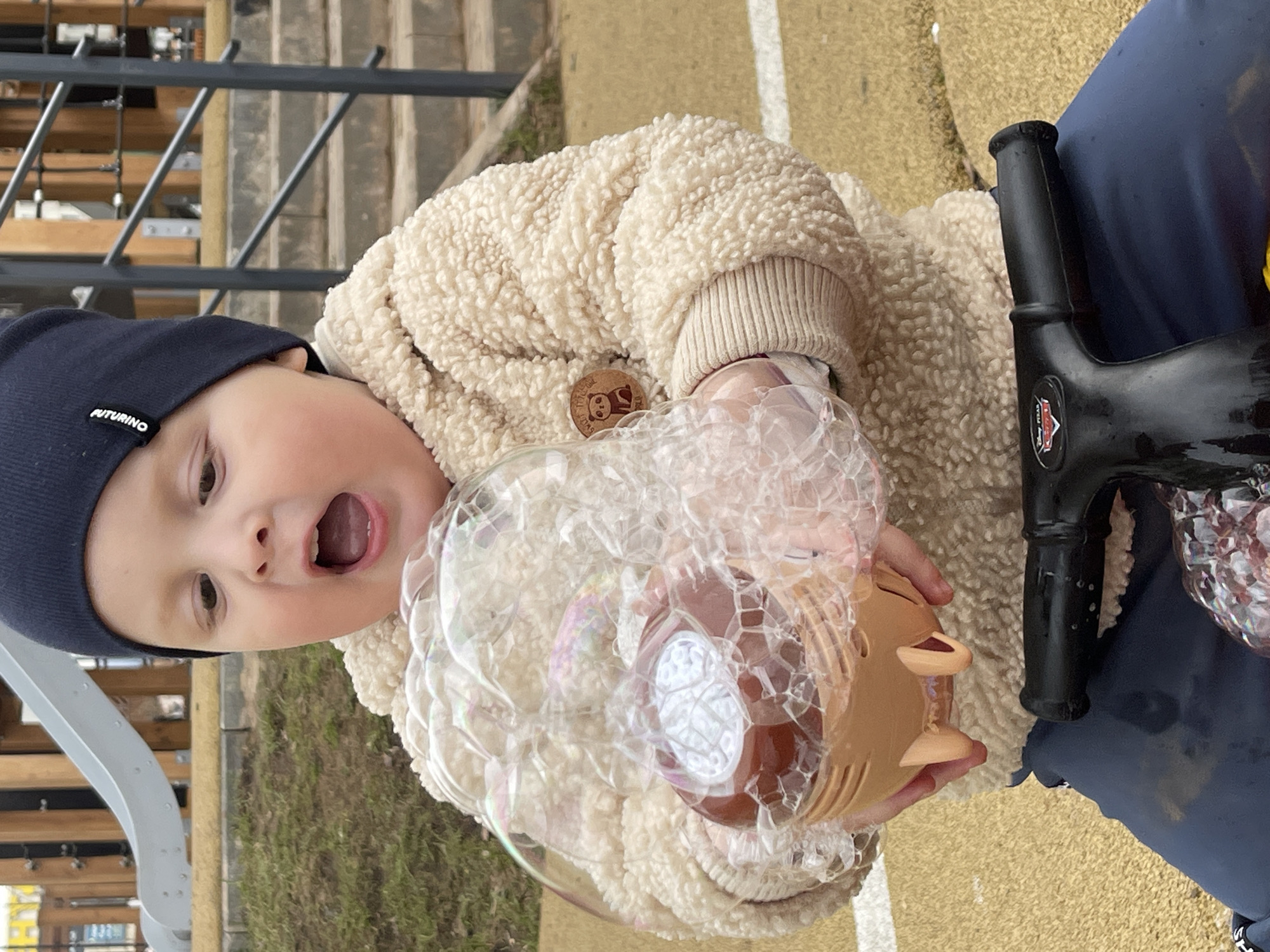 Child plays with bubbles in Izhevsk, Russia