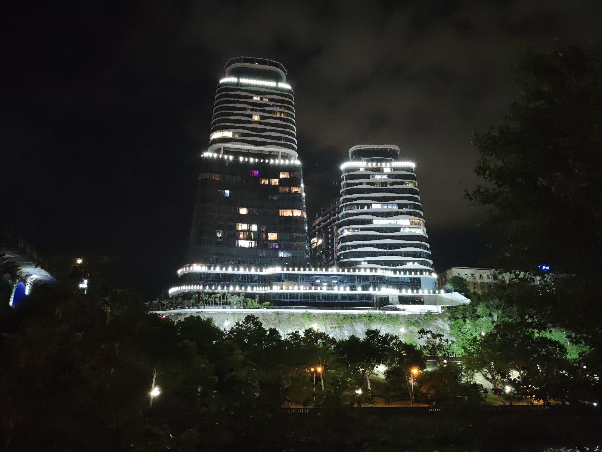 Tbilisi at night: Orbi Towers and lit-up city signage