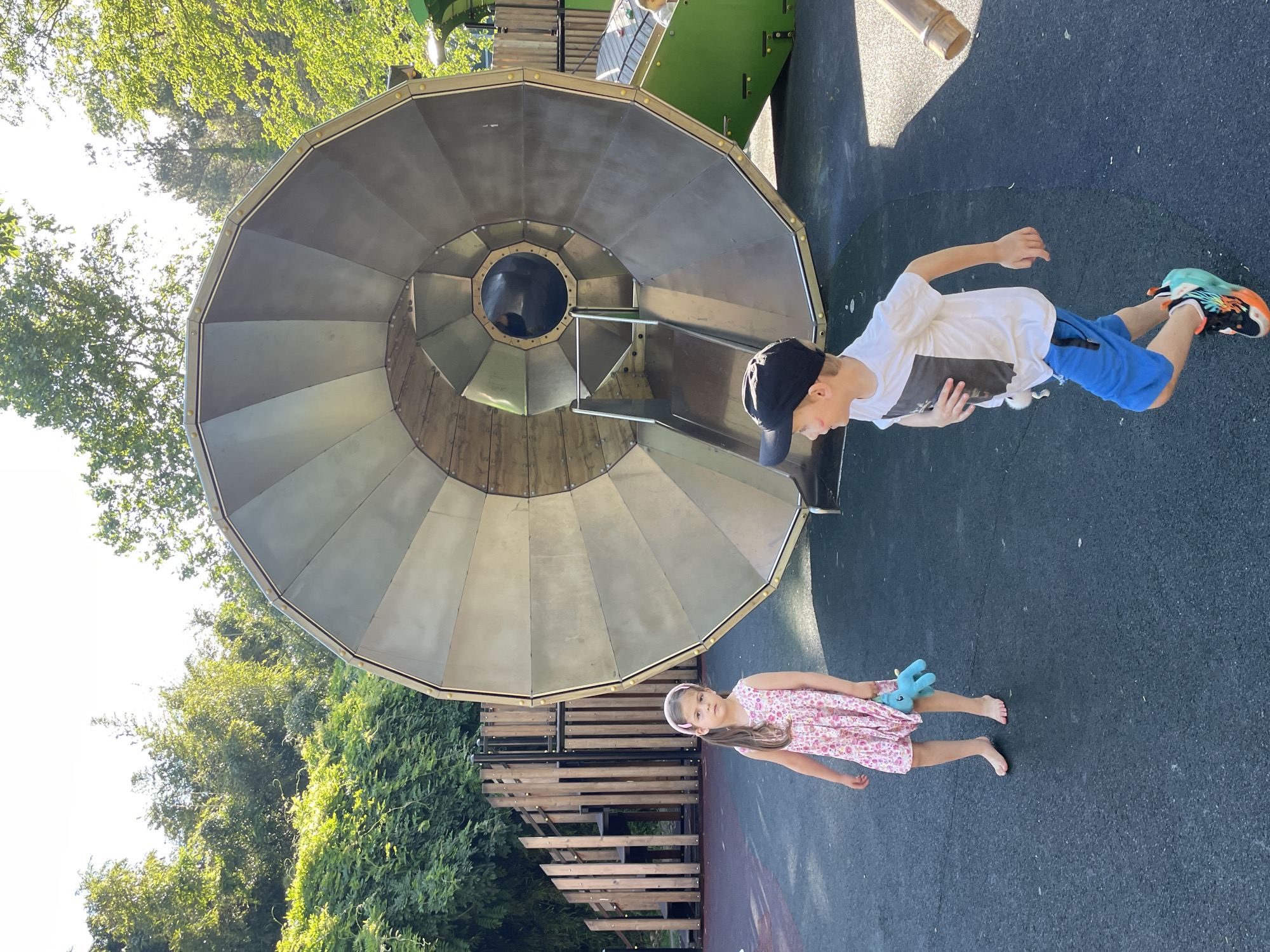 Family explores Sochi parks and playgrounds on summer afternoon