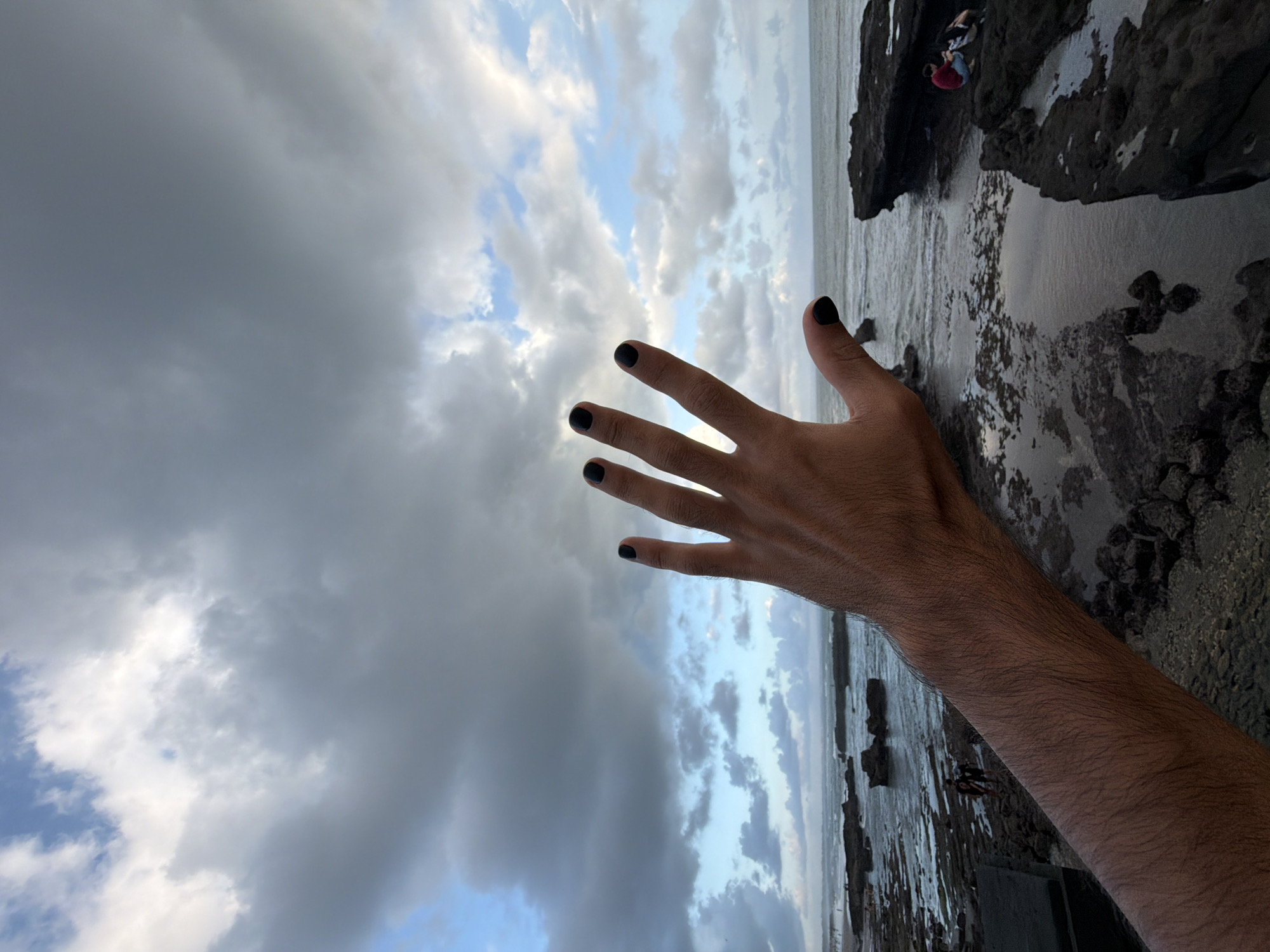 Person photographed in artistic hand poses in North Kuta