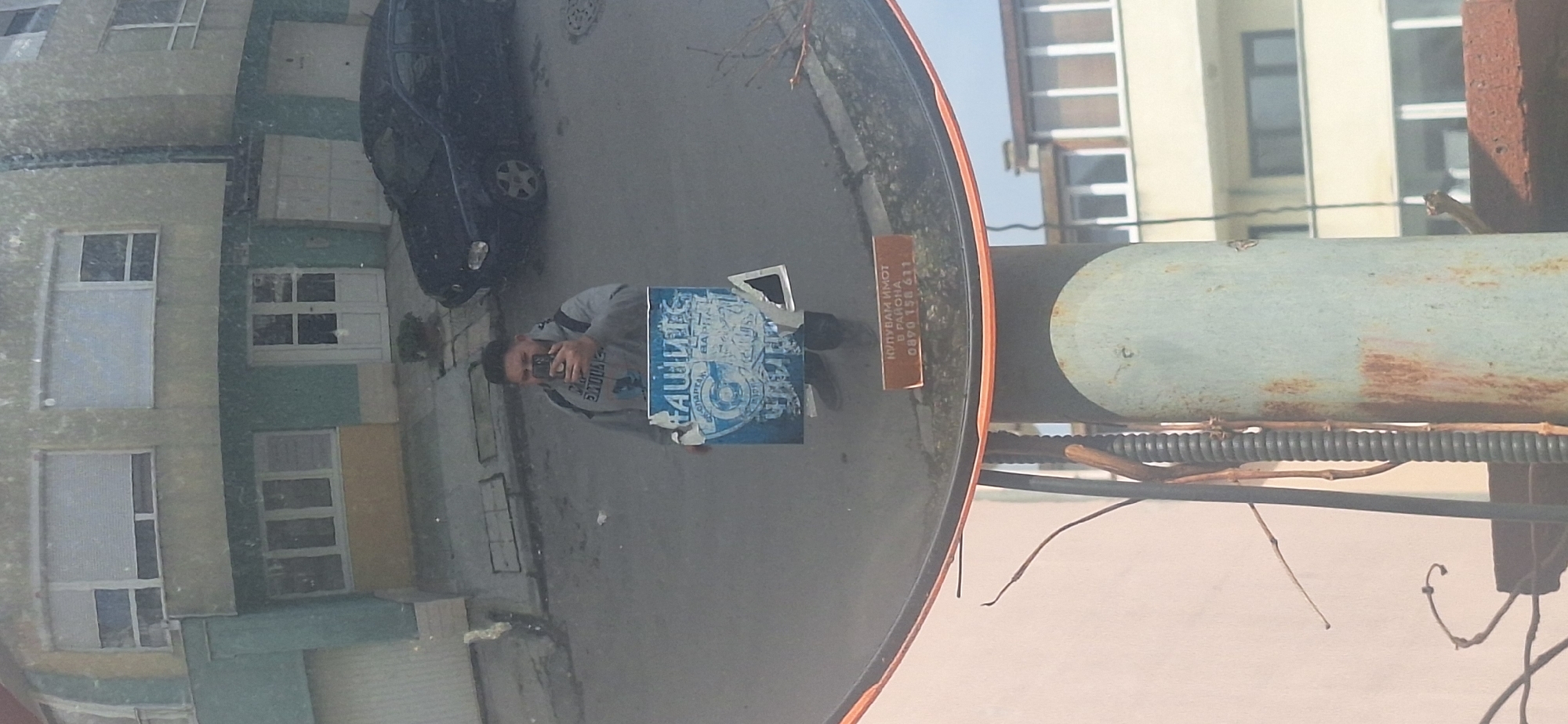 Man takes selfie on Varna street, captured in mirror