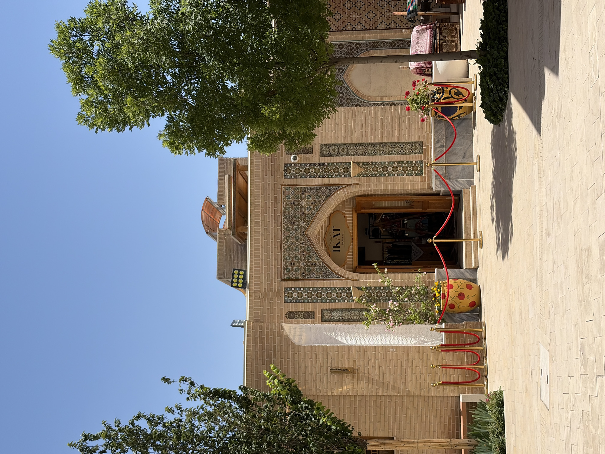 Tourist explores traditional architecture and markets in Kuchtumgali, Uzbekistan