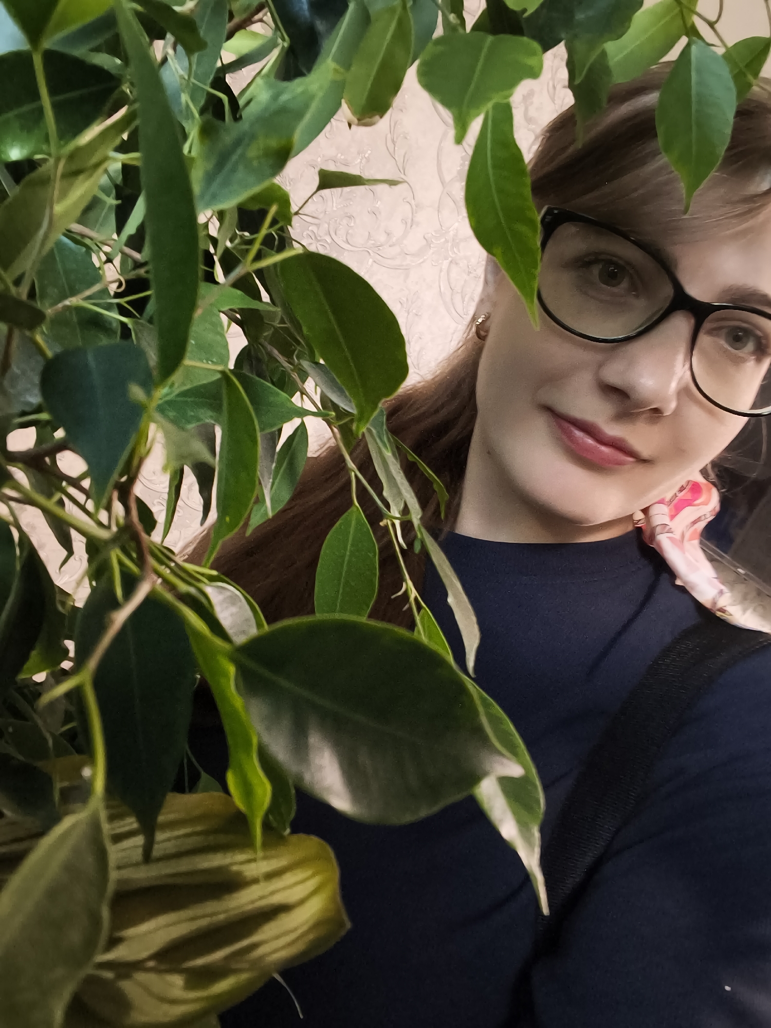 Casual selfie framed by green foliage in Novaya Usman'
