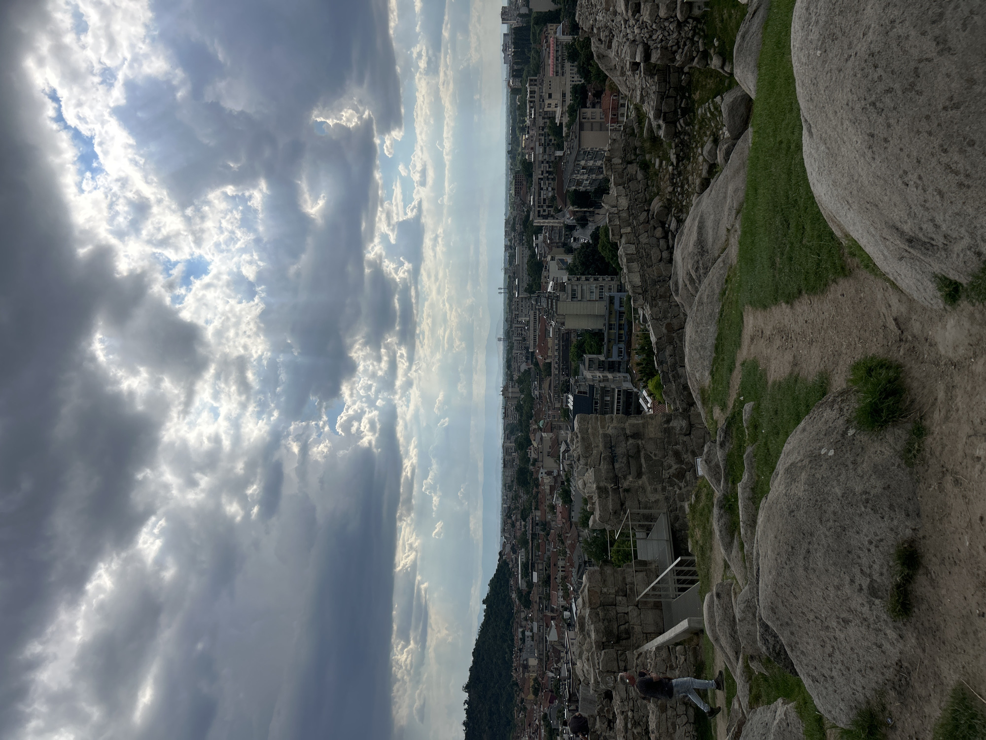 Ancient amphitheater, fountains, and city views on a sunny afternoon