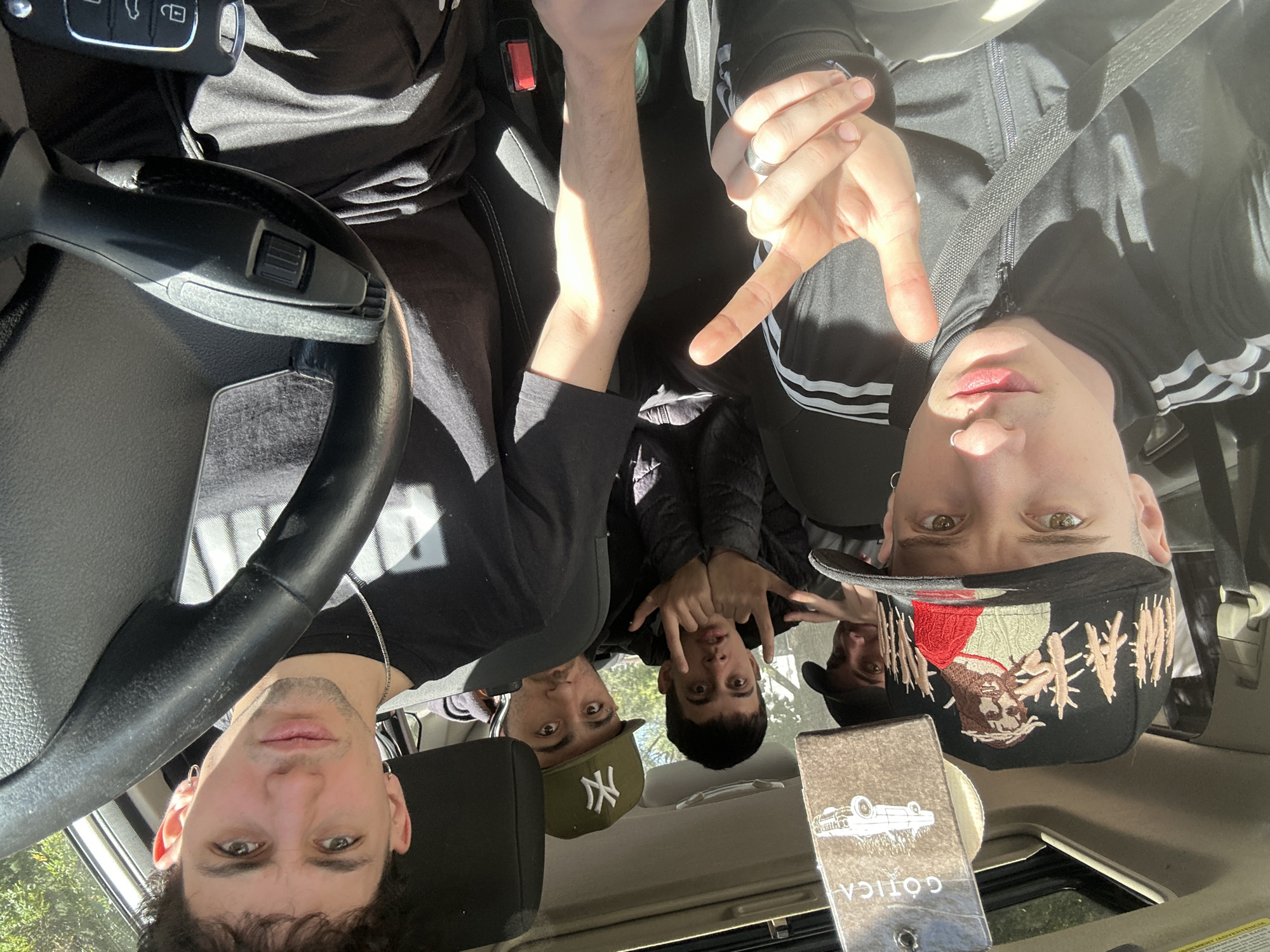 Young men take car selfies in sunny Buenos Aires