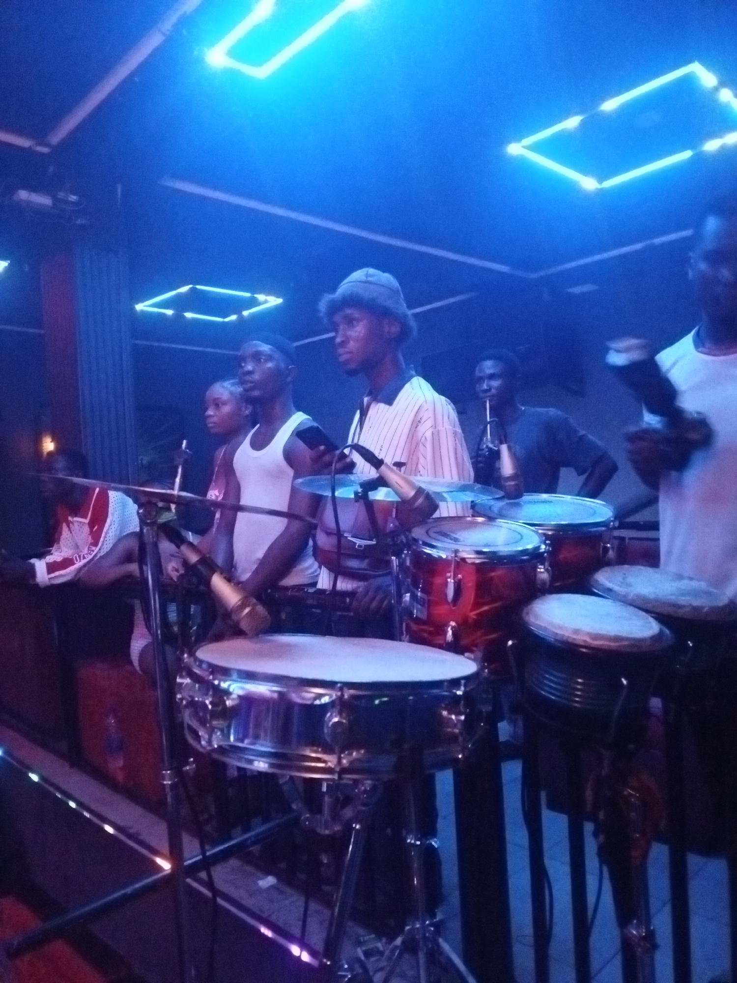 Live music performance at nightclub features Rolling Stones branding