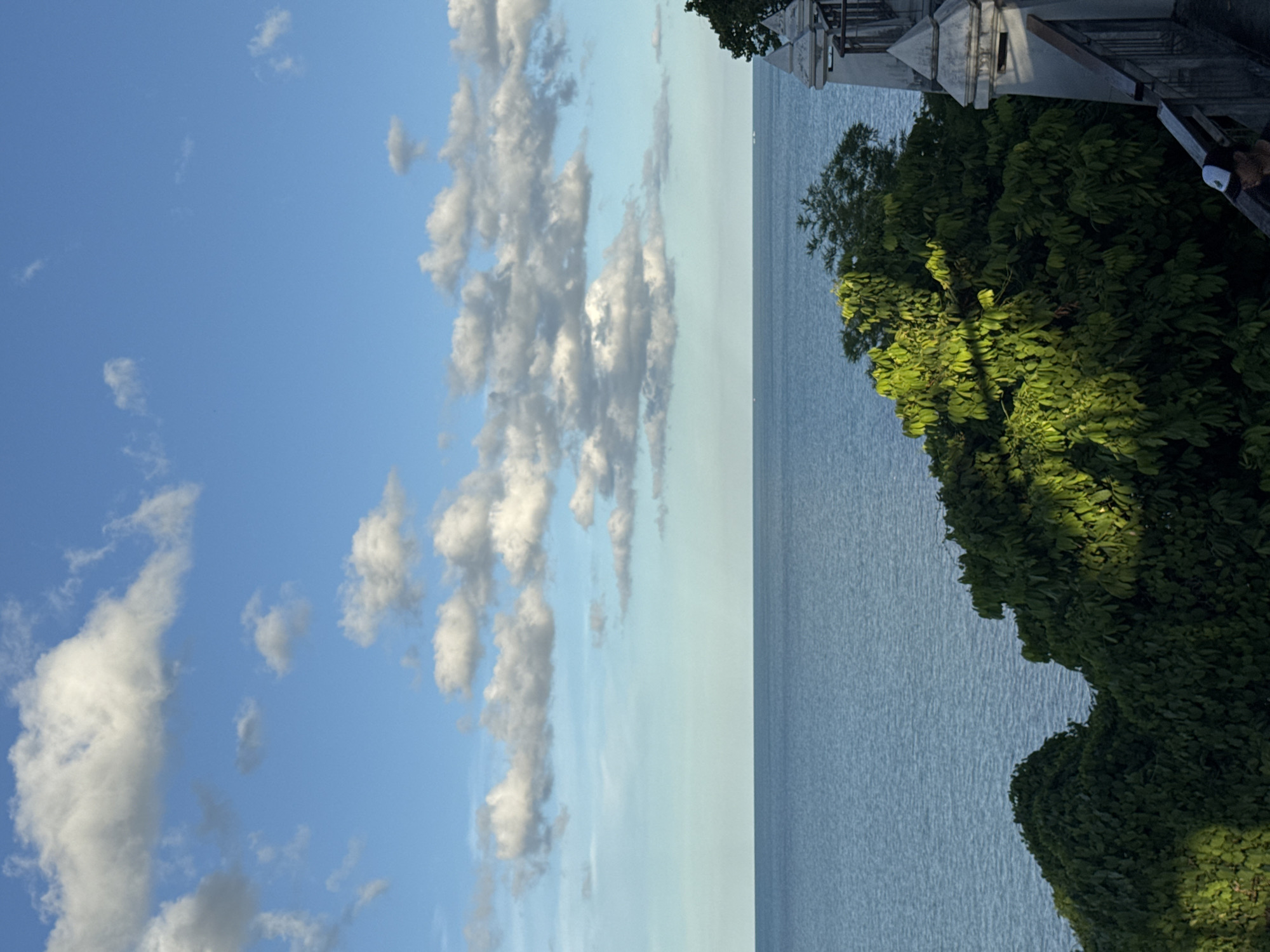 Morning stroll along a tropical clifftop walkway with ocean views