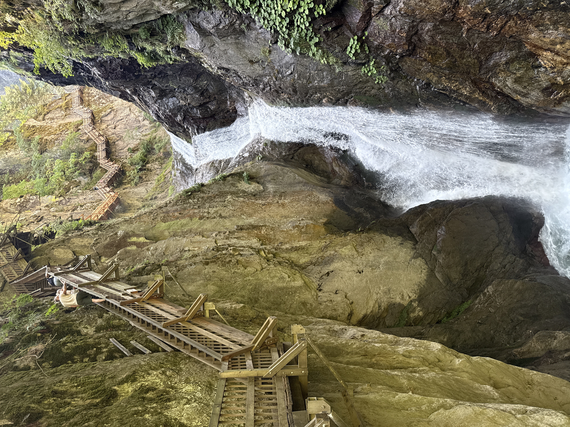 Walking the wooden catwalks through Gorge du Trient's waterfall canyon