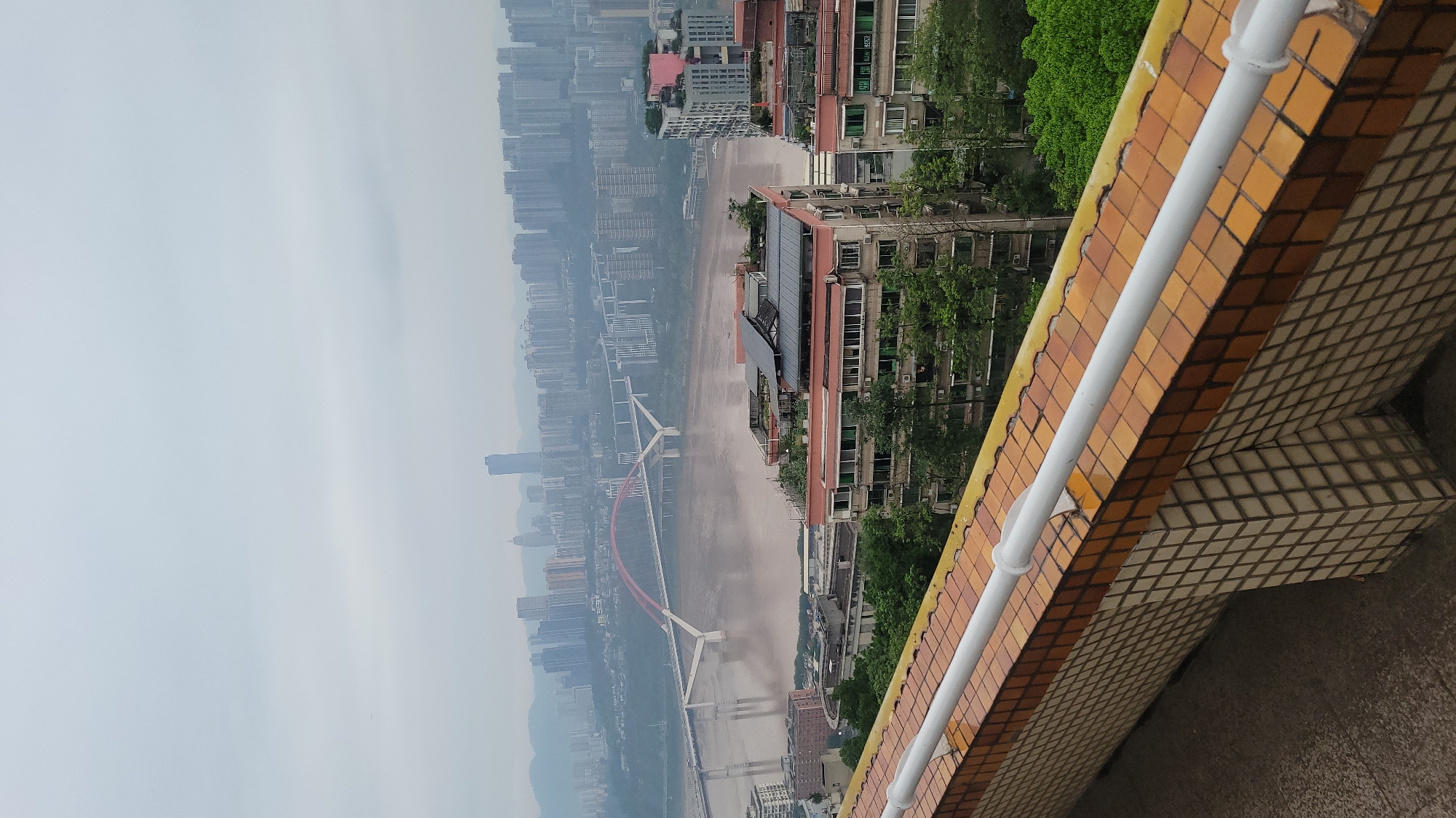 Aerial views document riverfront city during nine-minute observation period