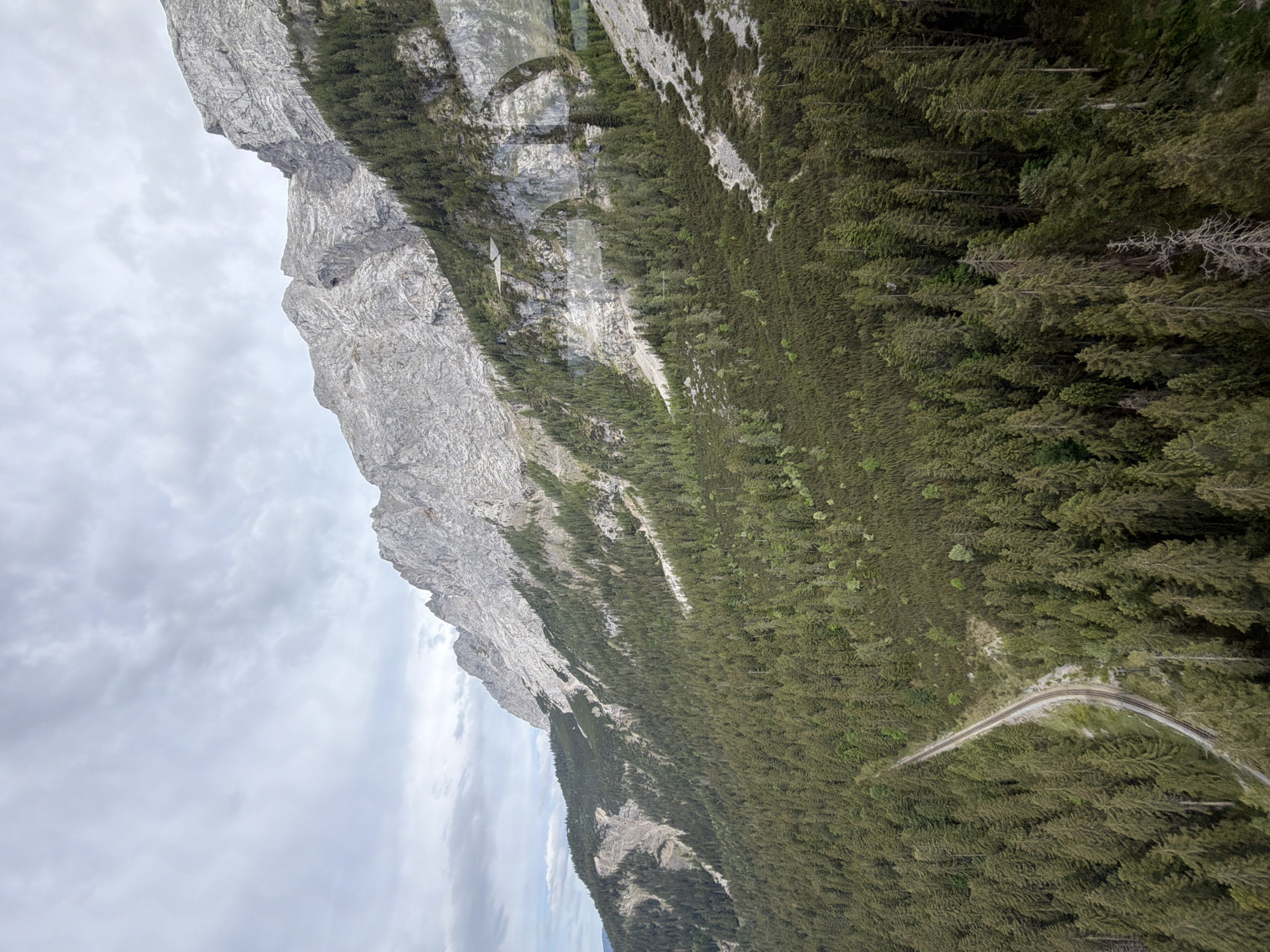 Zugspitze peaks observed through cloudy skies from Grainau