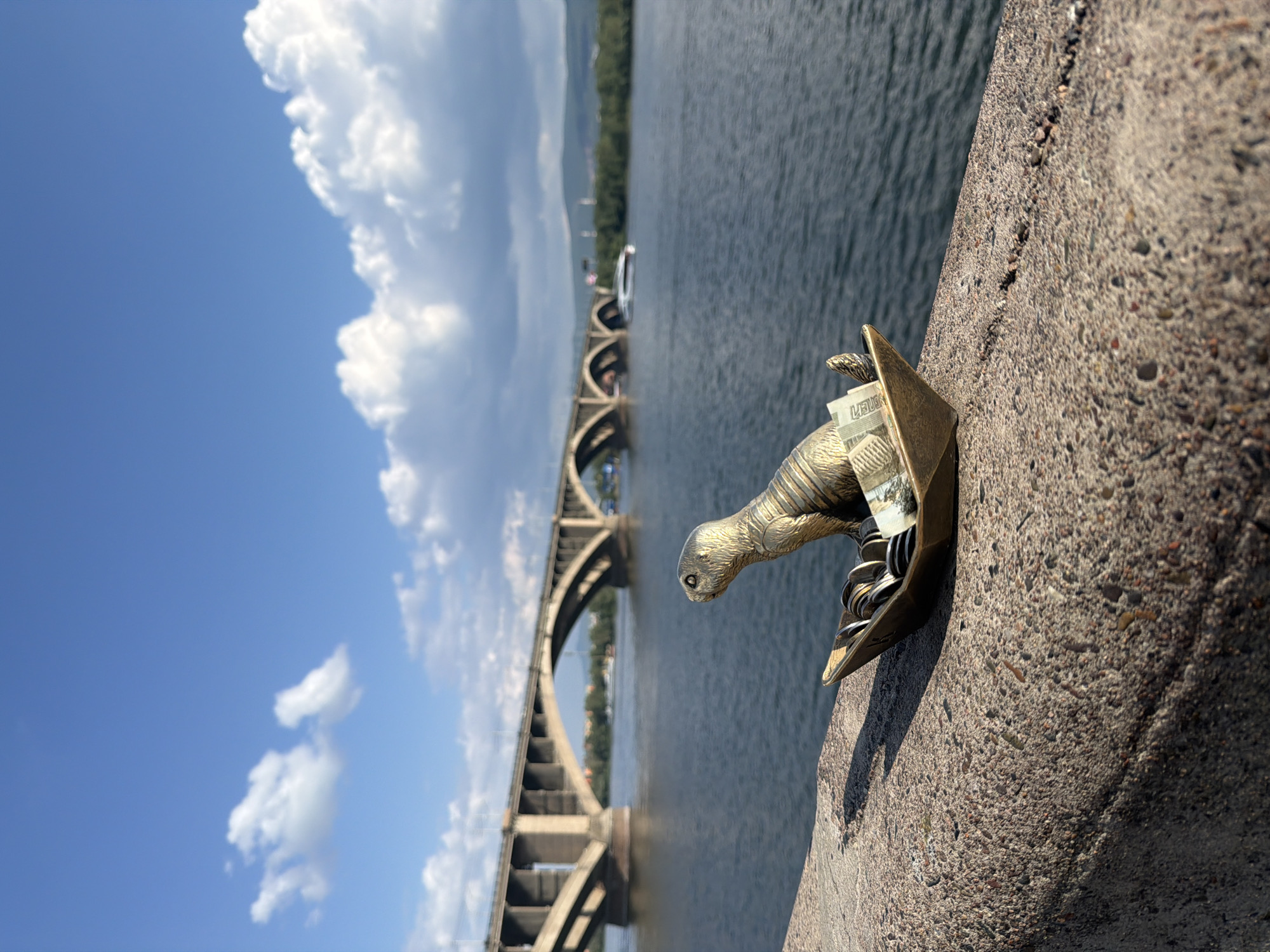 Coin-filled beaver sculpture at a Krasnoyarsk good-luck spot