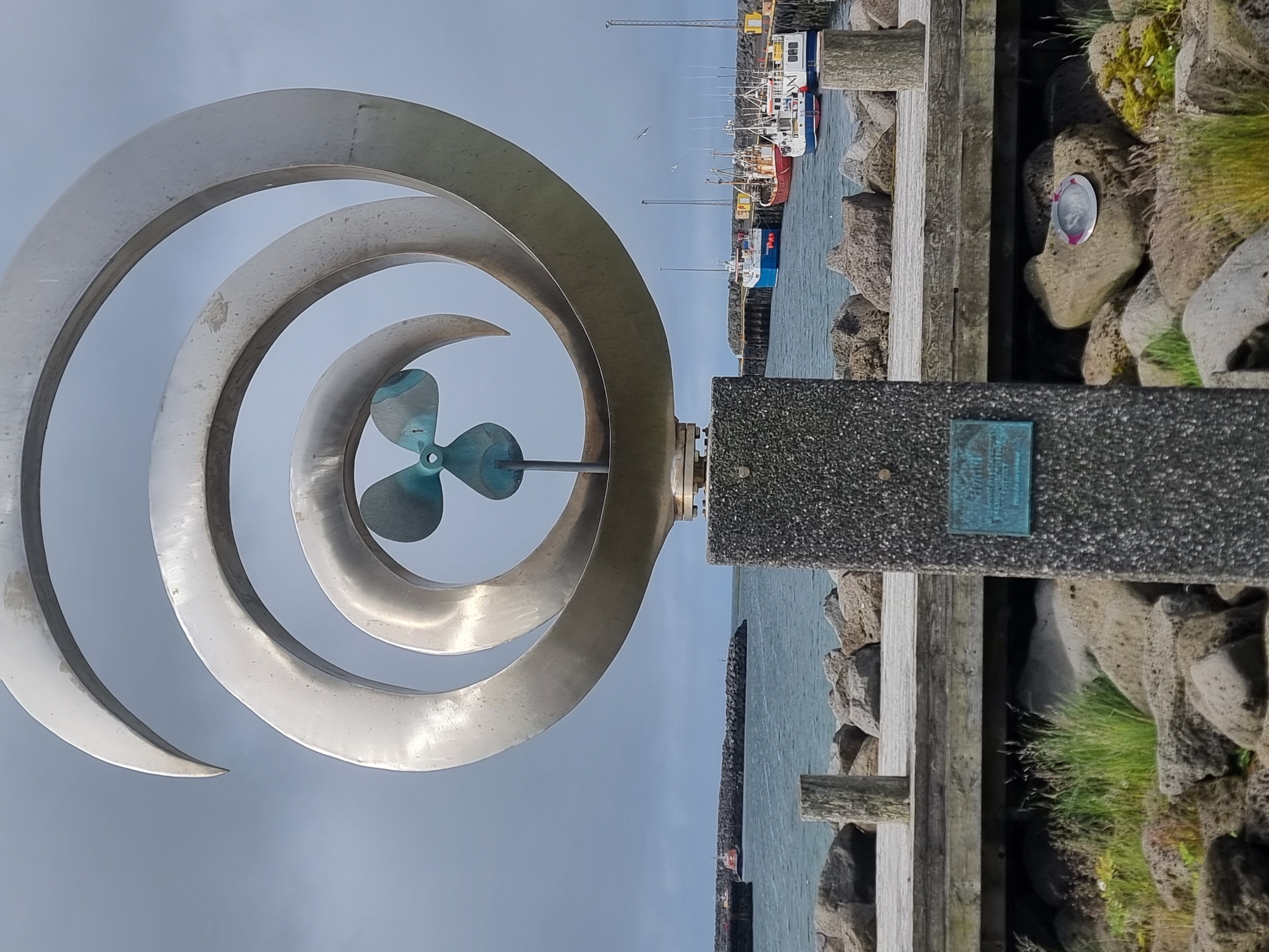 Sandgerði landmarks: metal sculpture and yellow antenna tower