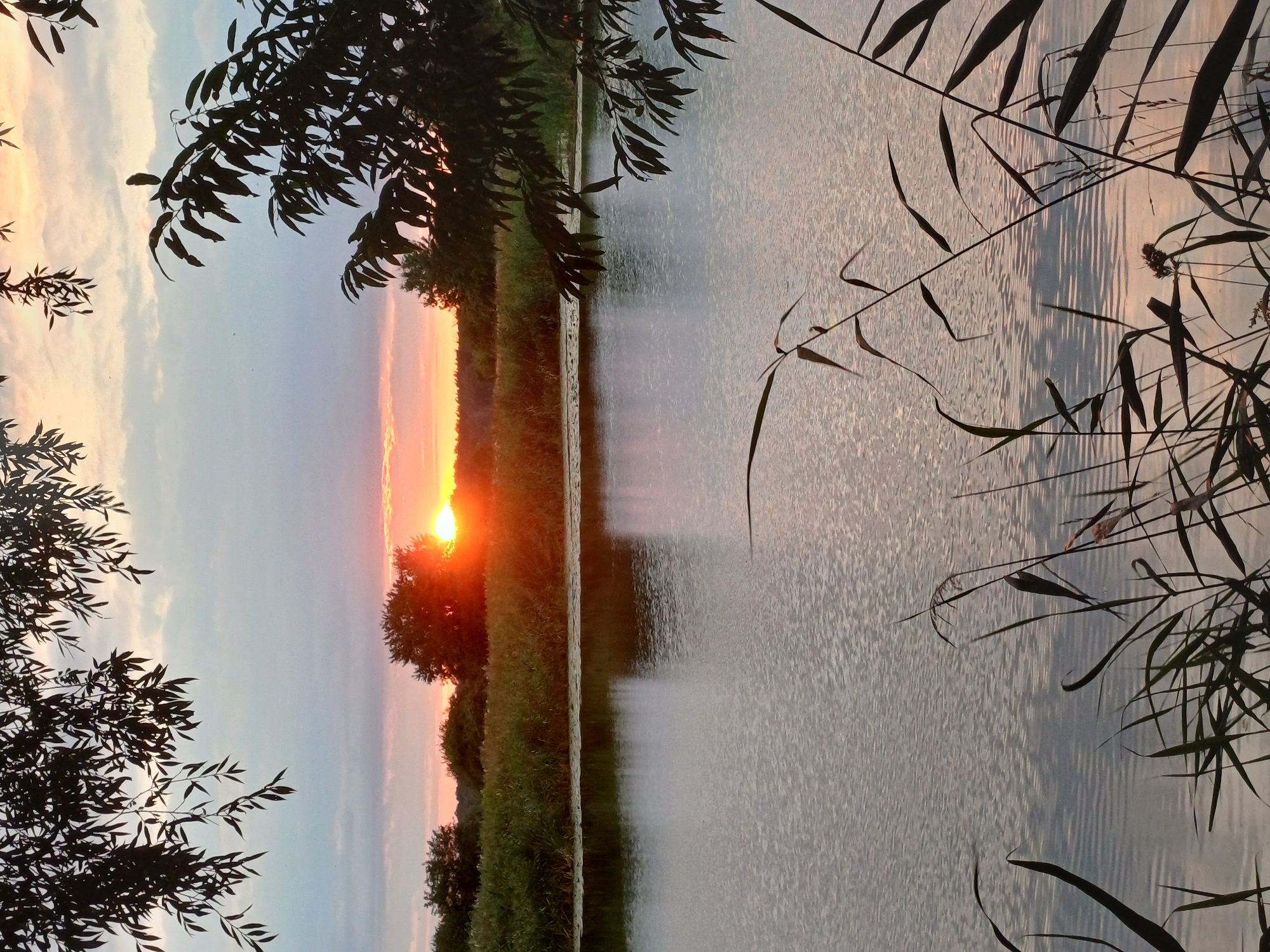 August sunset over Riga's waterways and open fields