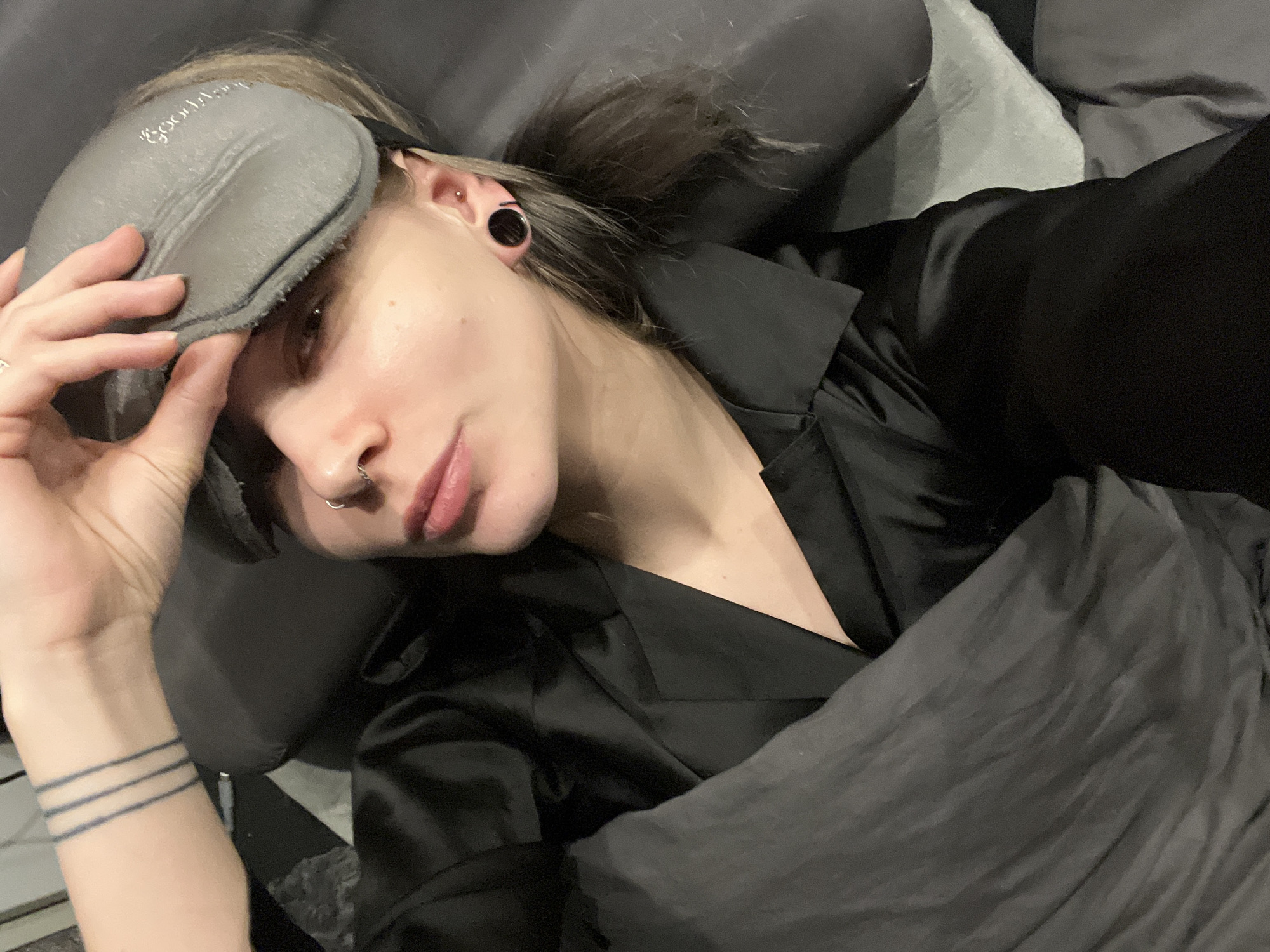 Person photographed in bed during early morning in Khimki