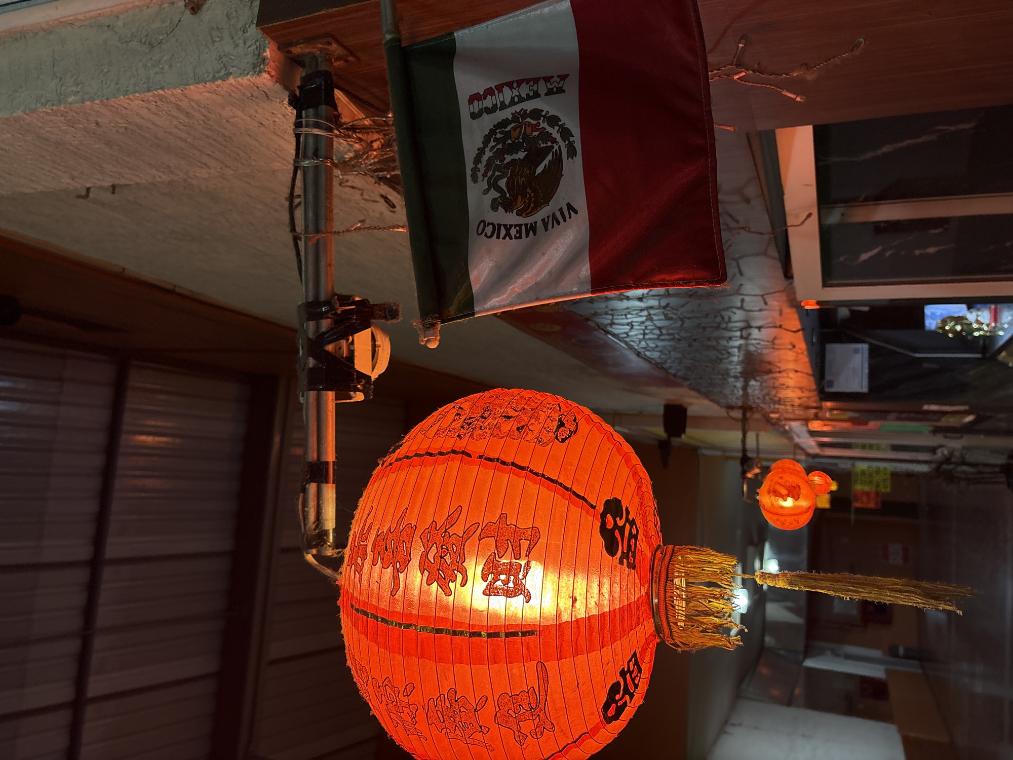 Decorated Chinese lantern illuminates Cuernavaca street scene at night