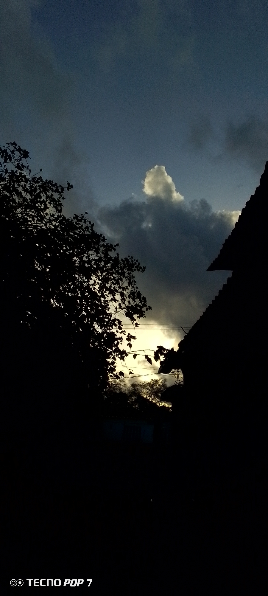Dramatic skies and street life documented in Venezuelan town