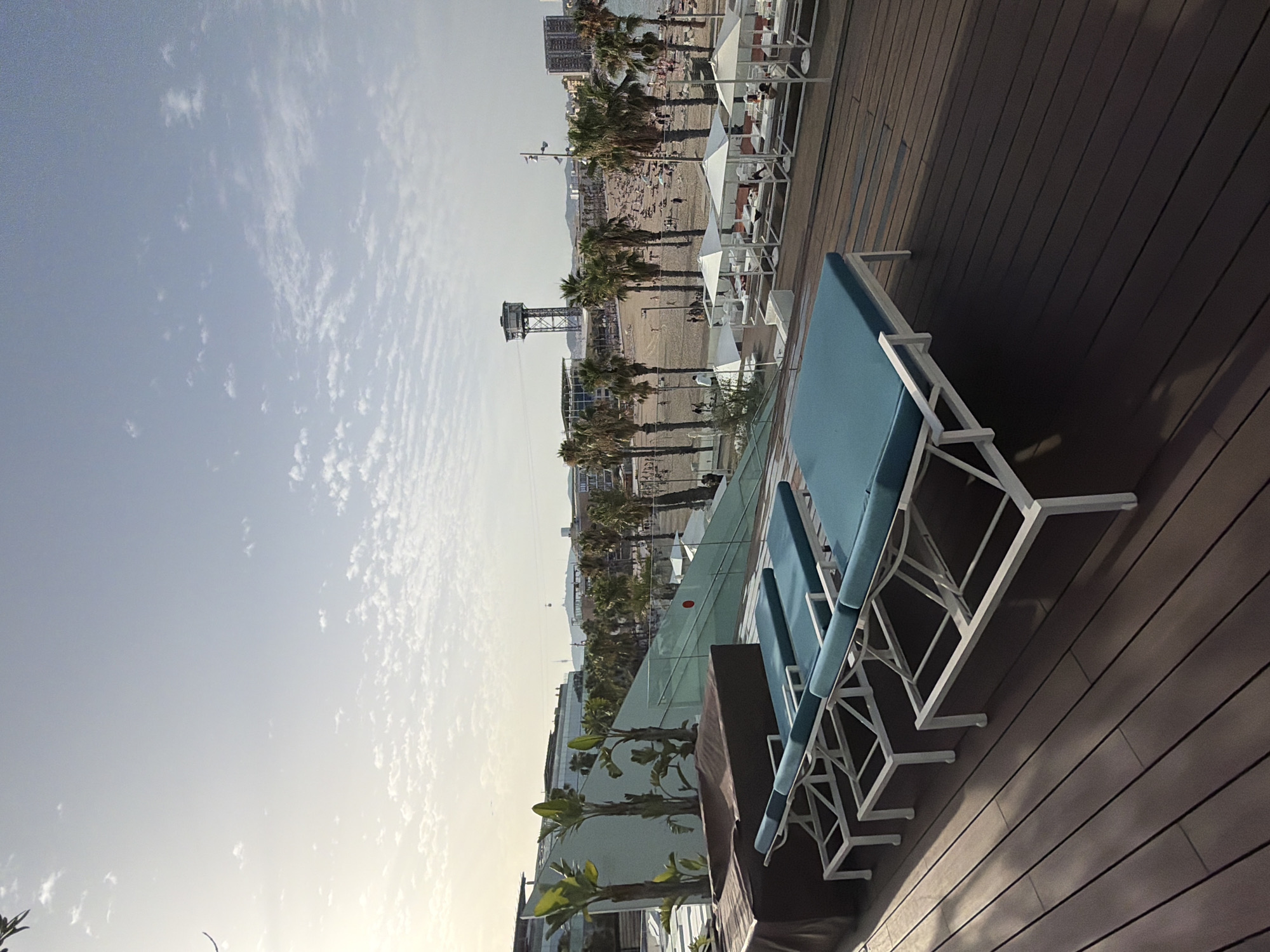 Rooftop terrace views over a packed Barceloneta Beach