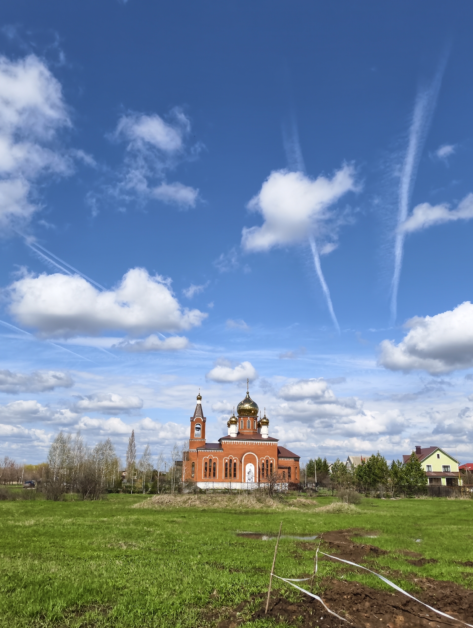 Aircraft contrails spotted over Balashov, Russia on clear morning