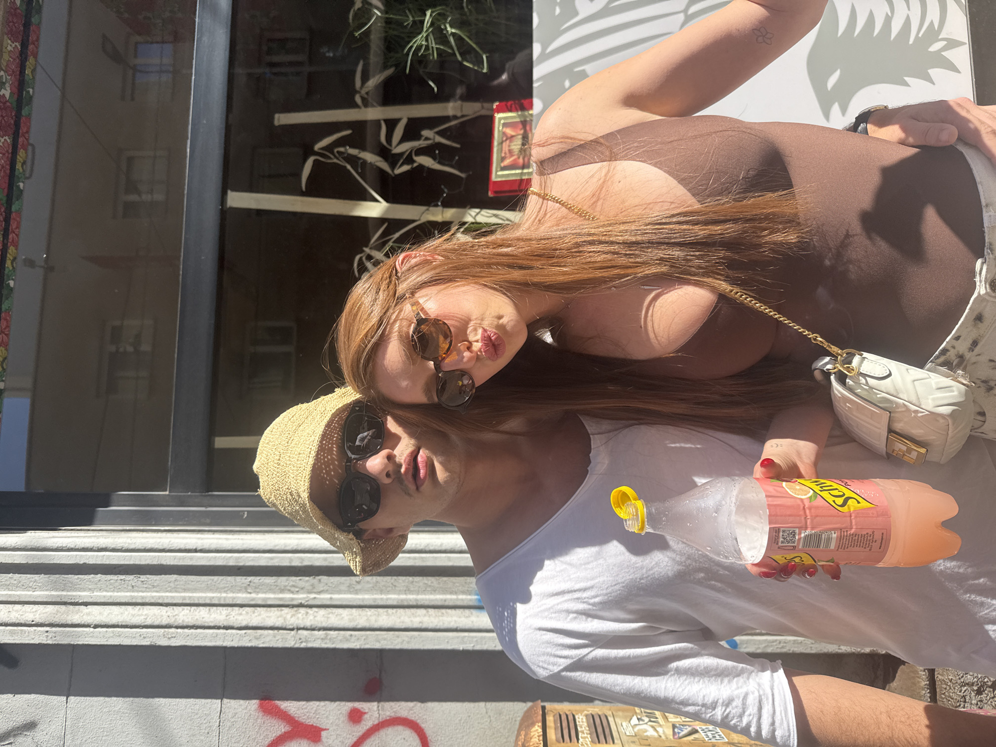 Two people pose for photo on Milan street