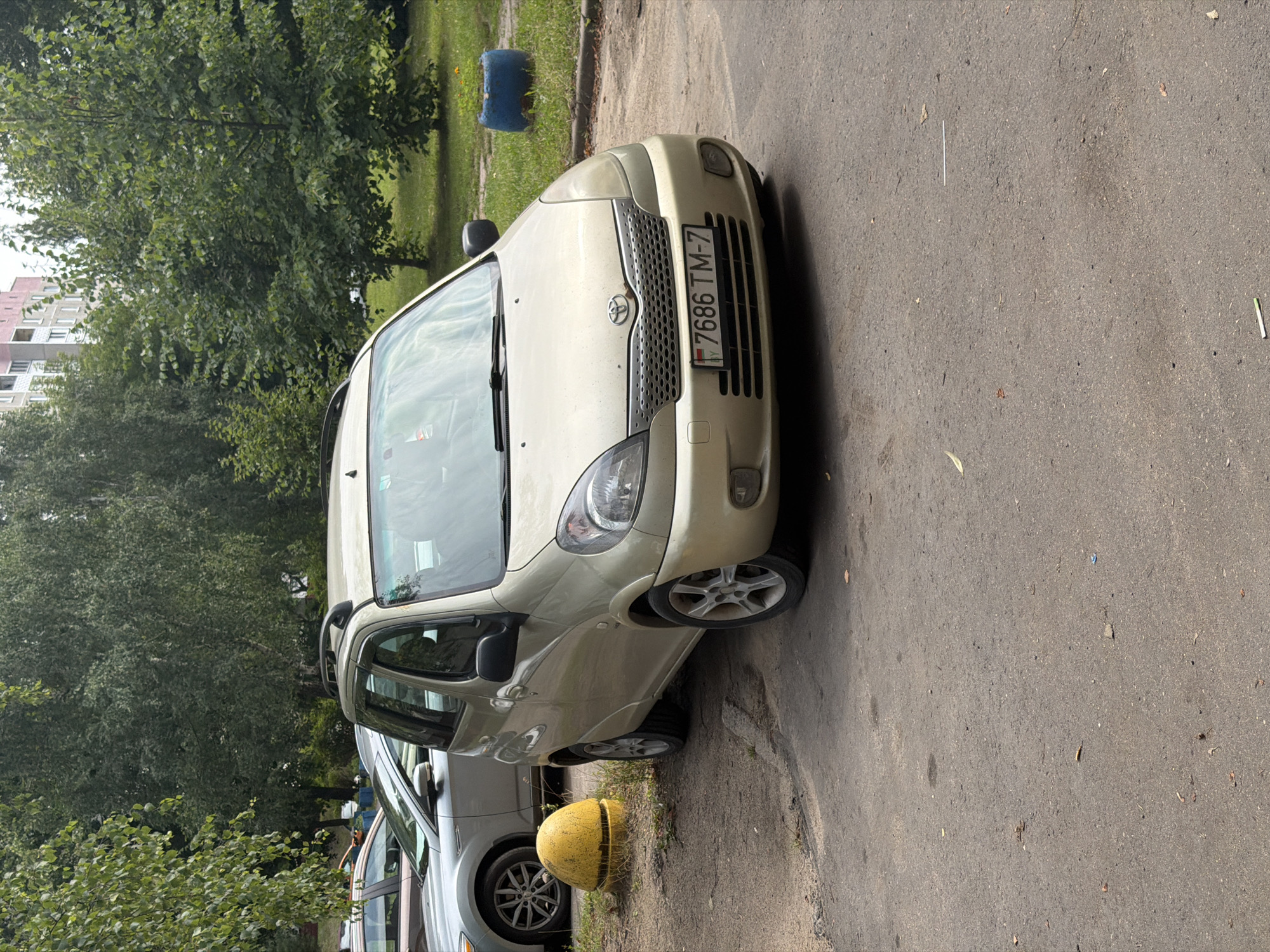 Parked cars and pigeons on a quiet Minsk residential street