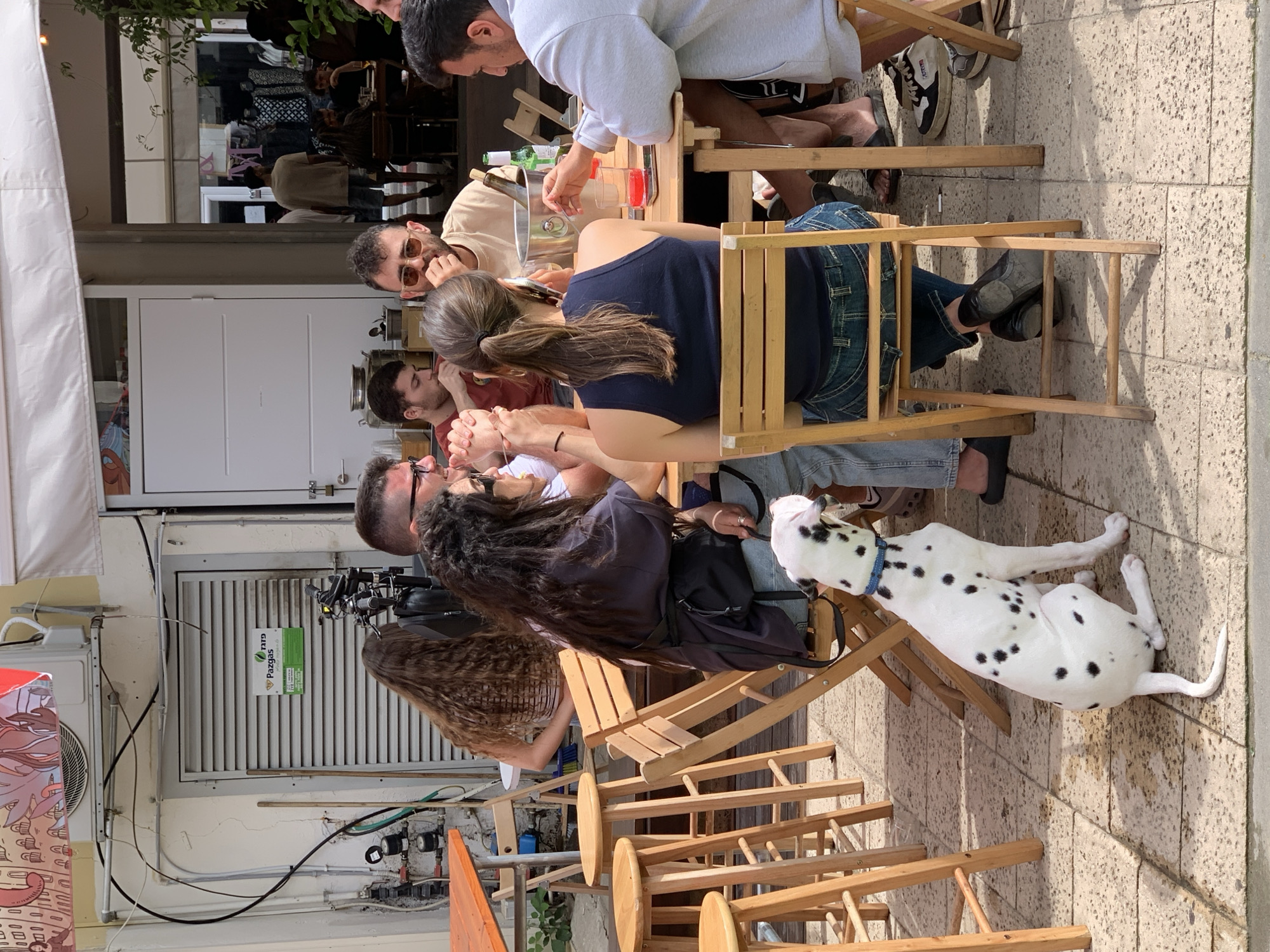 Outdoor dining scene captured at Tel-Aviv street cafe