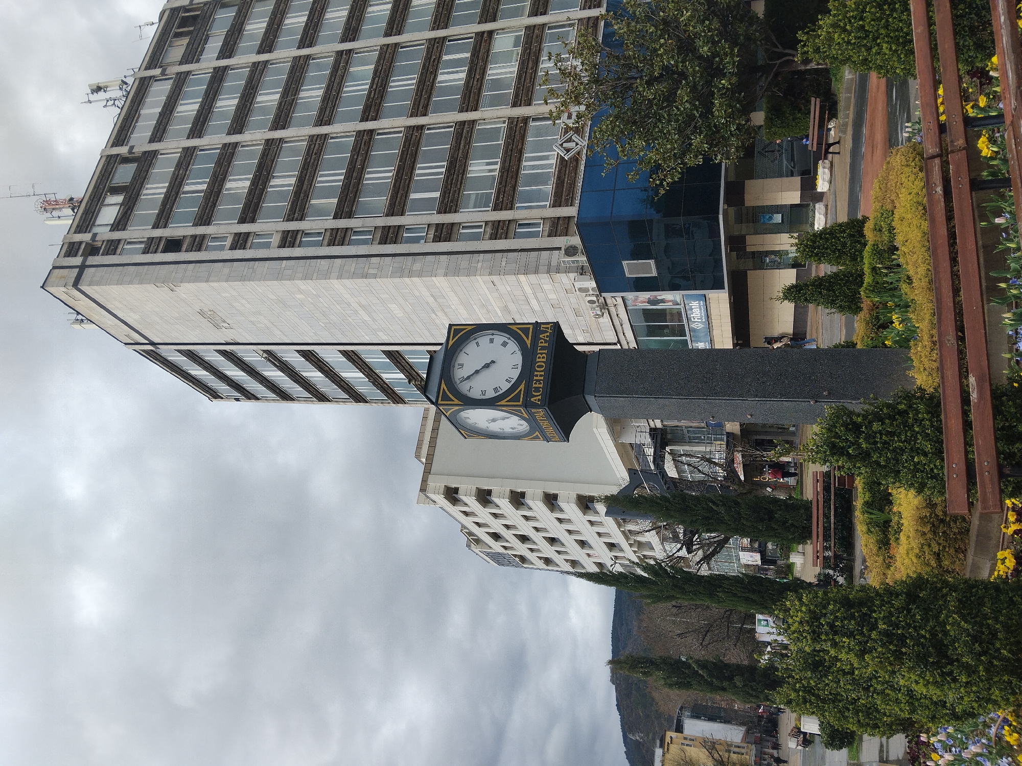 Office building and clock tower observed in Asenovgrad, Bulgaria