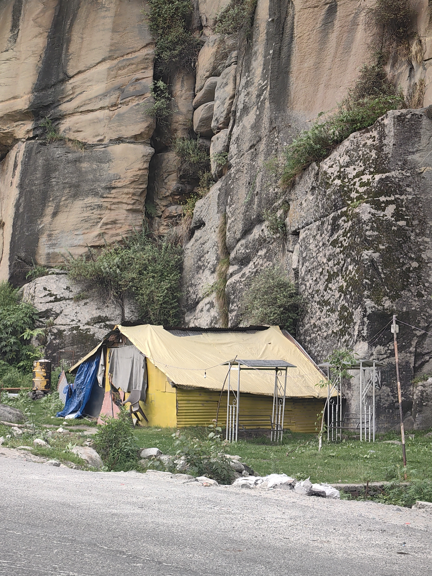 Red hilltop temple and surrounding scenes in Kulang, India