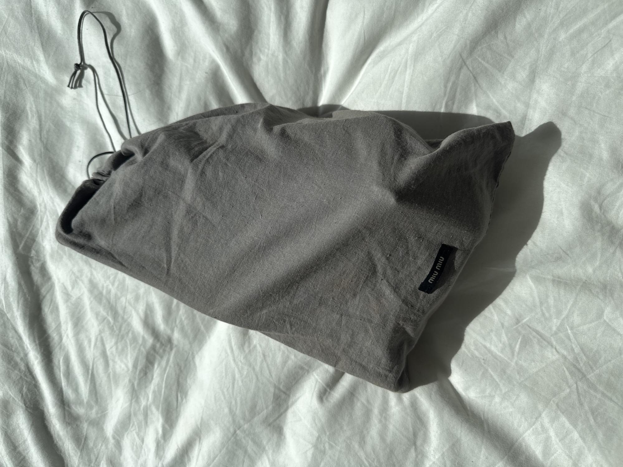 Designer fashion items documented in London flat lay display