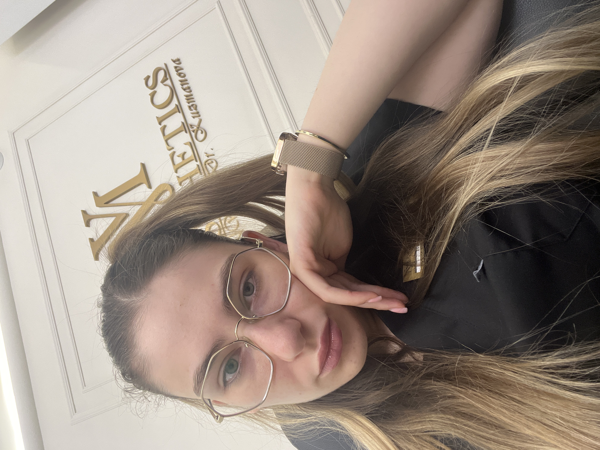 Selfie series featuring hexagonal glasses and a black embroidered top