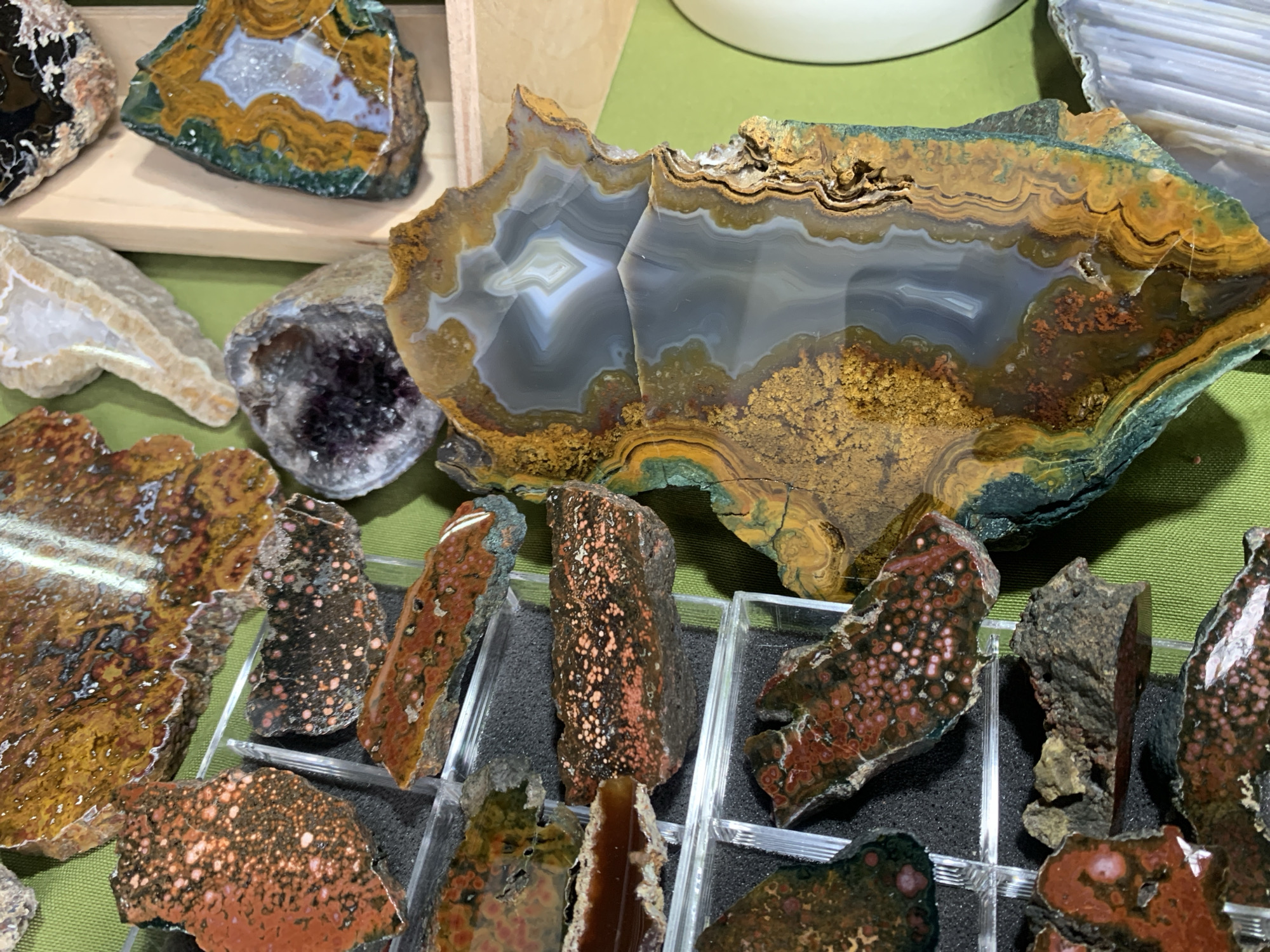 Person examines agate specimens and minerals in Sofia