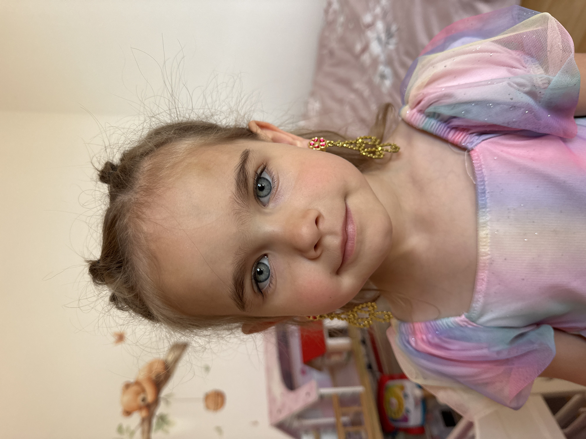 Young girl photographed smiling in colorful dress, Niederquembach