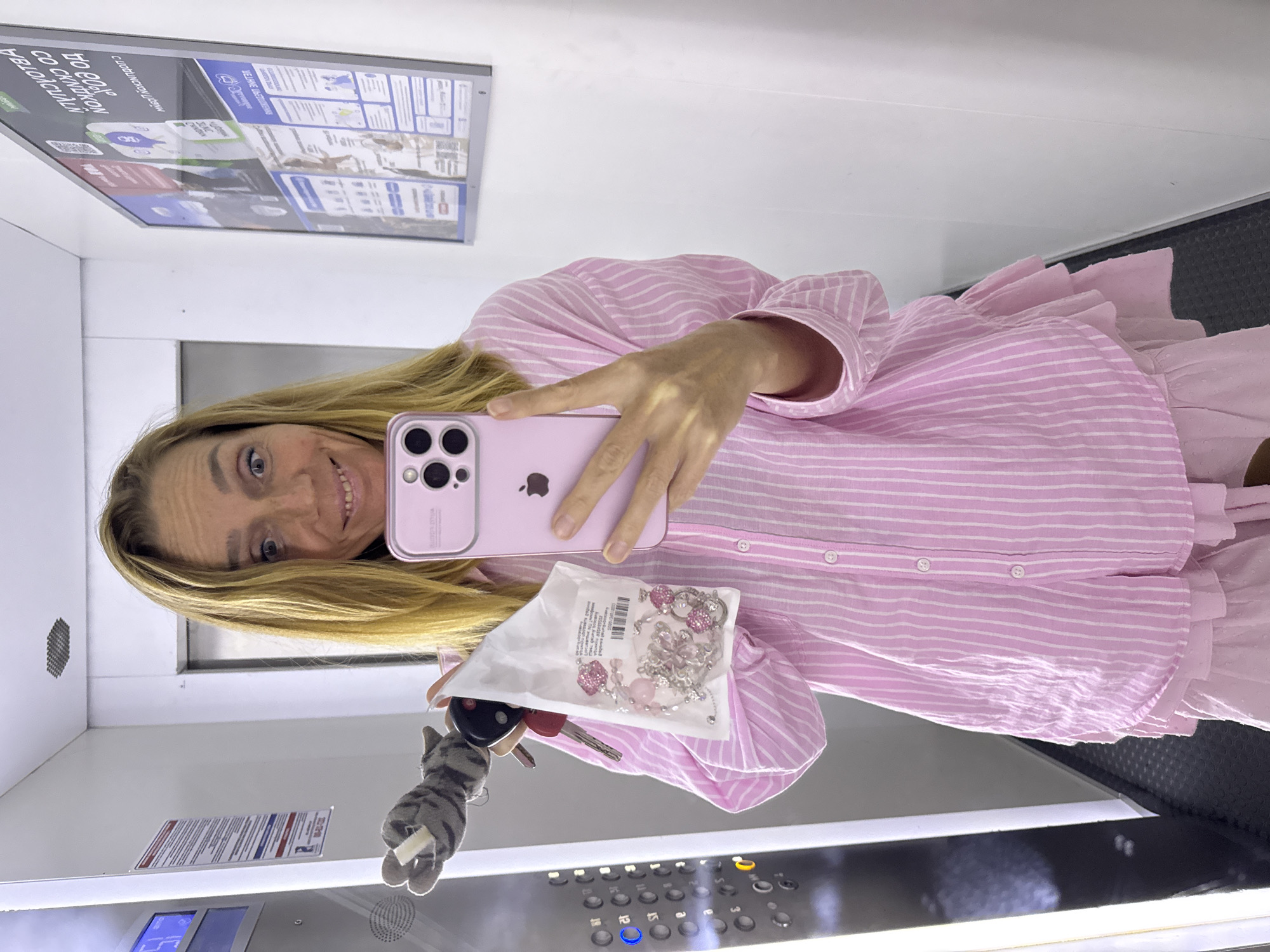 Elevator moment in Sinyavino with pink iPhone and jewelry