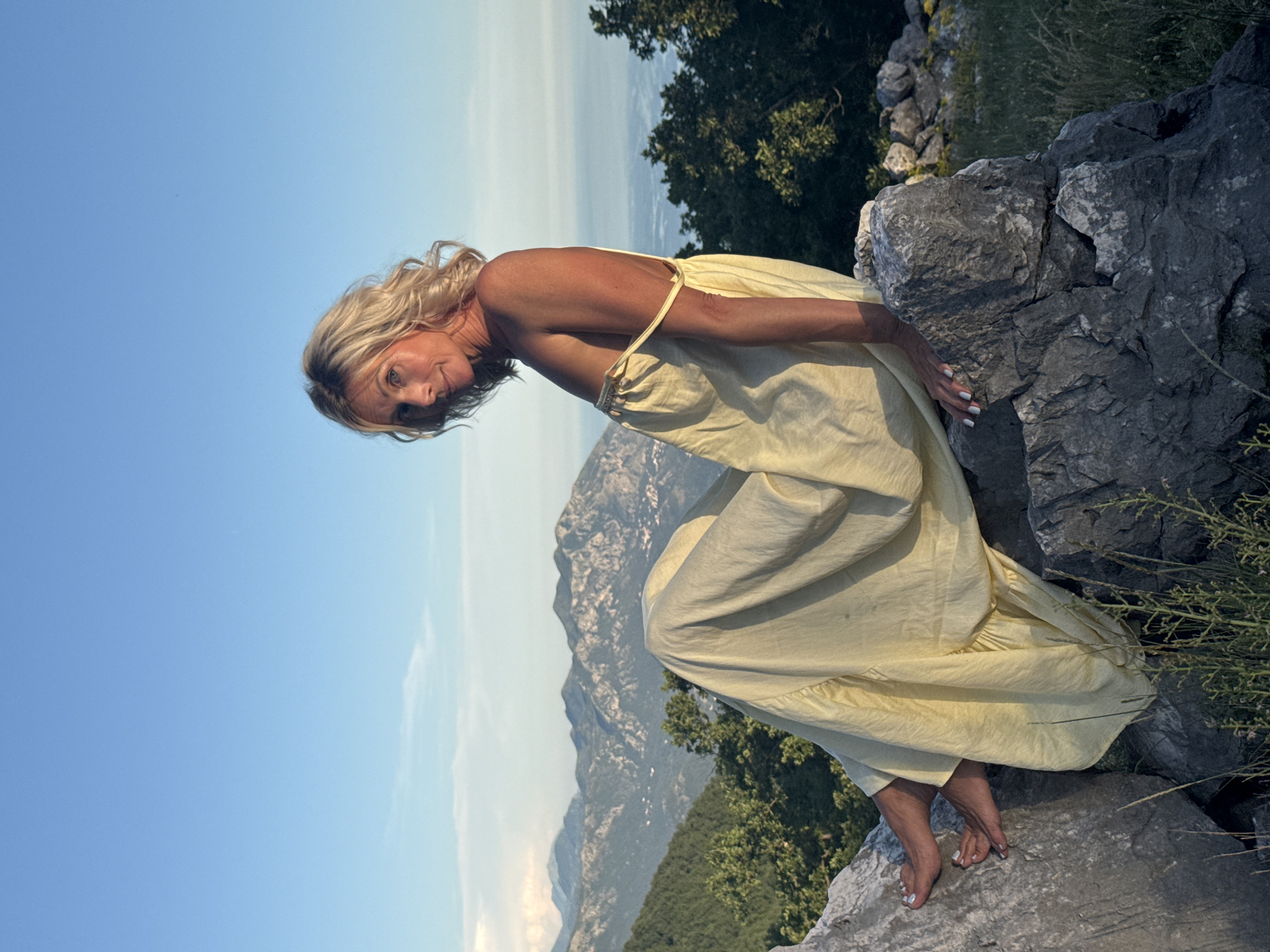 Woman in yellow dress photographed in Montenegro mountains