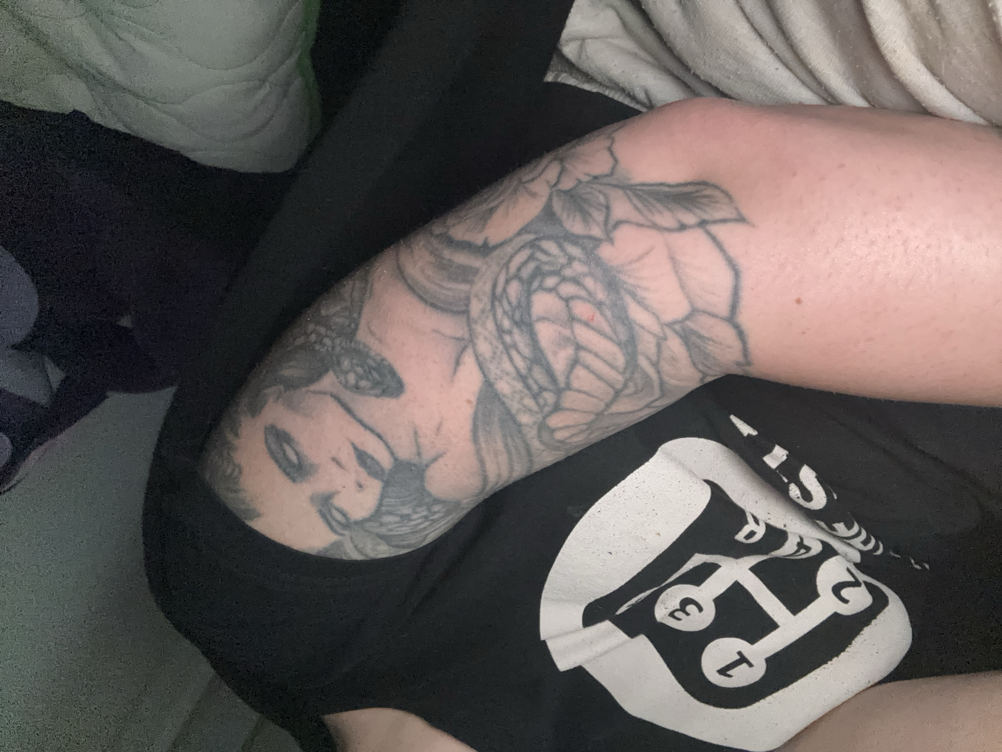Person with tattoos, gaming socks spotted indoors in Kuklen
