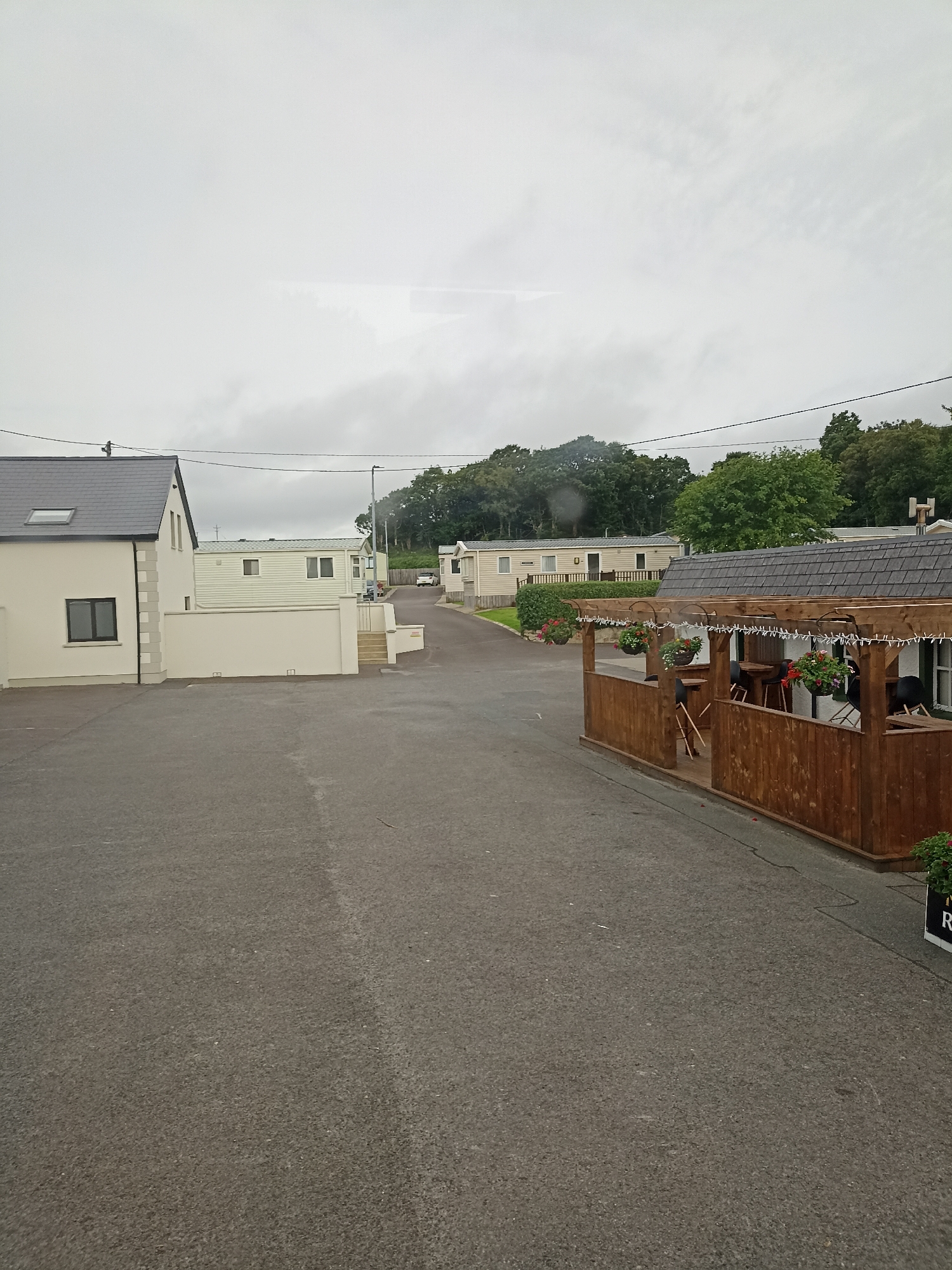 Passing through a coastal Irish caravan town on a grey morning