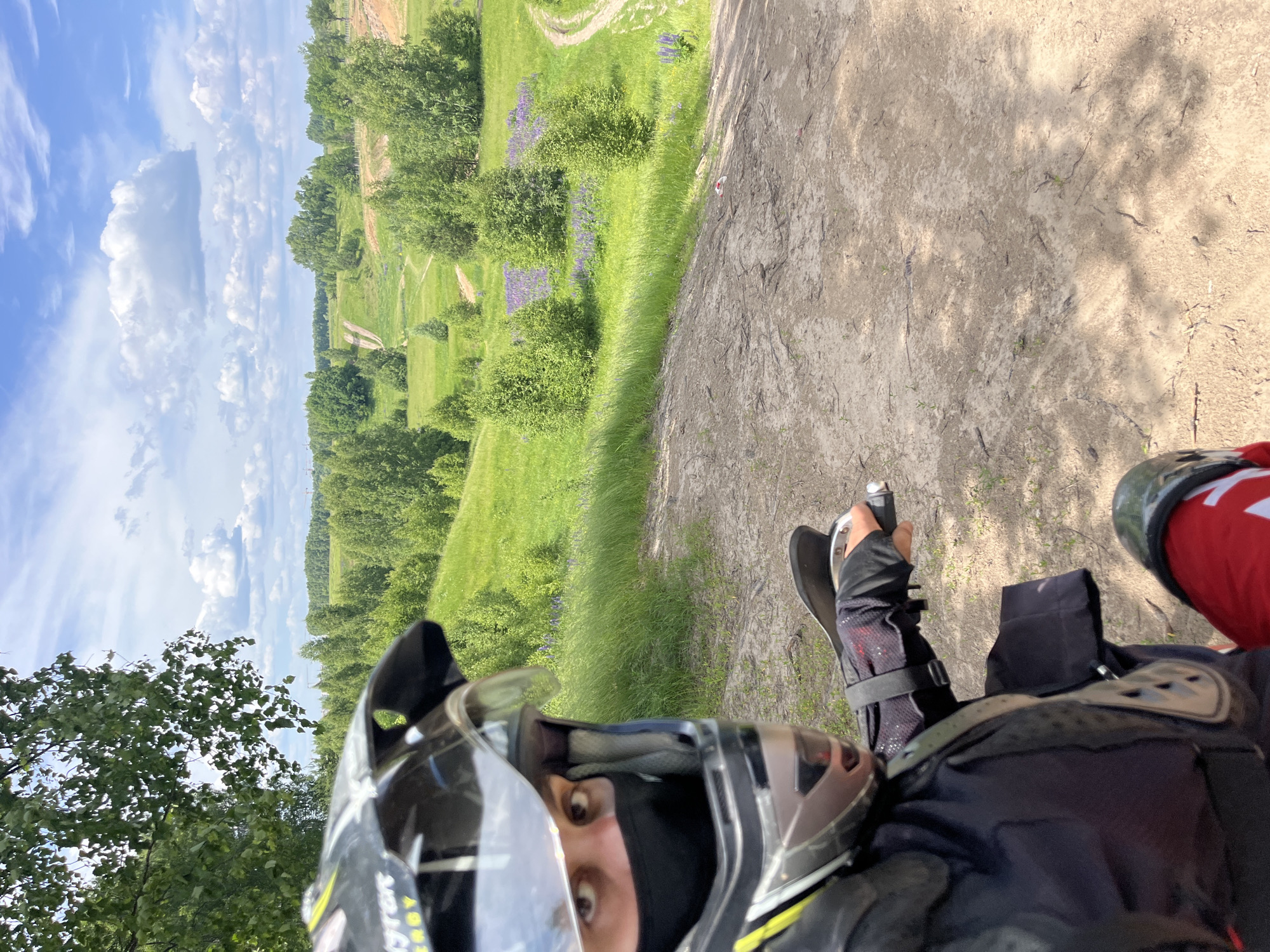 ATV rider explores birch forests and lupine fields in Russia