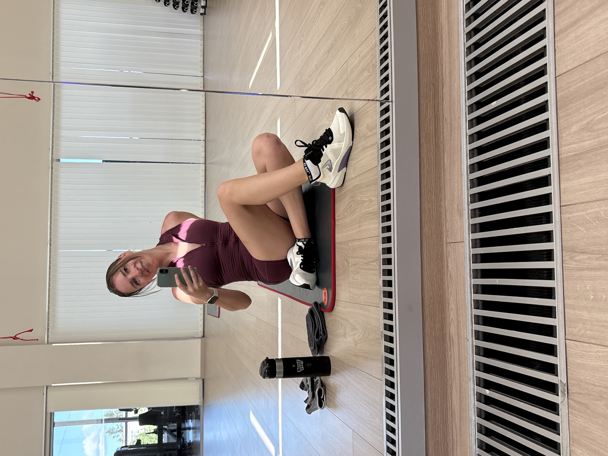 Gym session in Petrozavodsk: mat setup and dumbbell rack