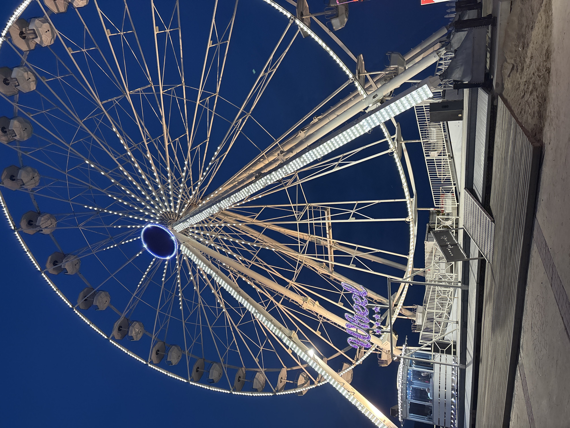 Illuminated Ferris wheel observed operating in Nesebar, Bulgaria
