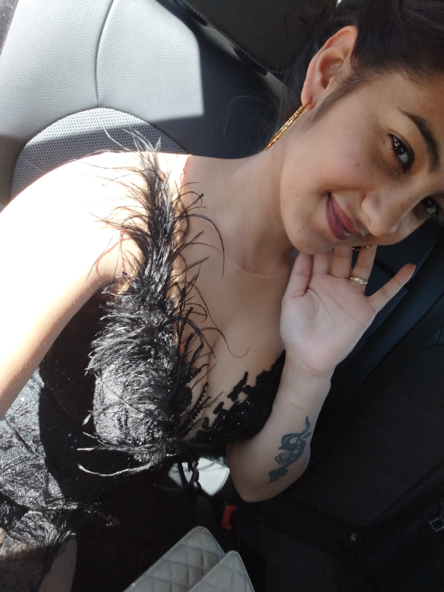 Getting ready and traveling to formal event in feathered dress