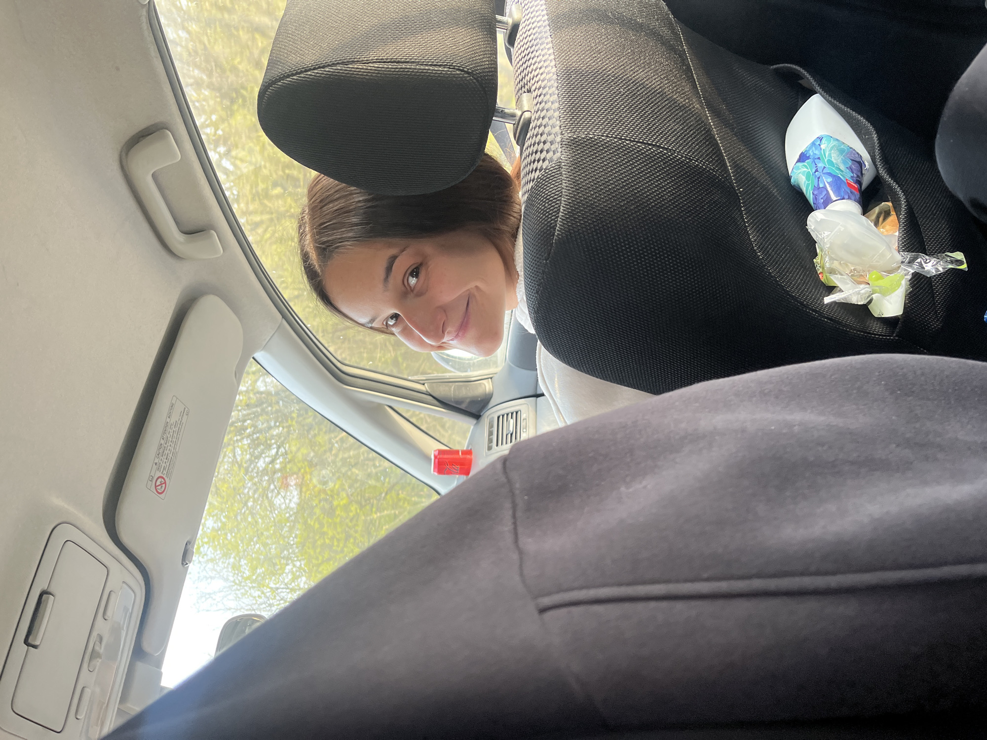 Woman photographed smiling inside car in Topolovo, Bulgaria