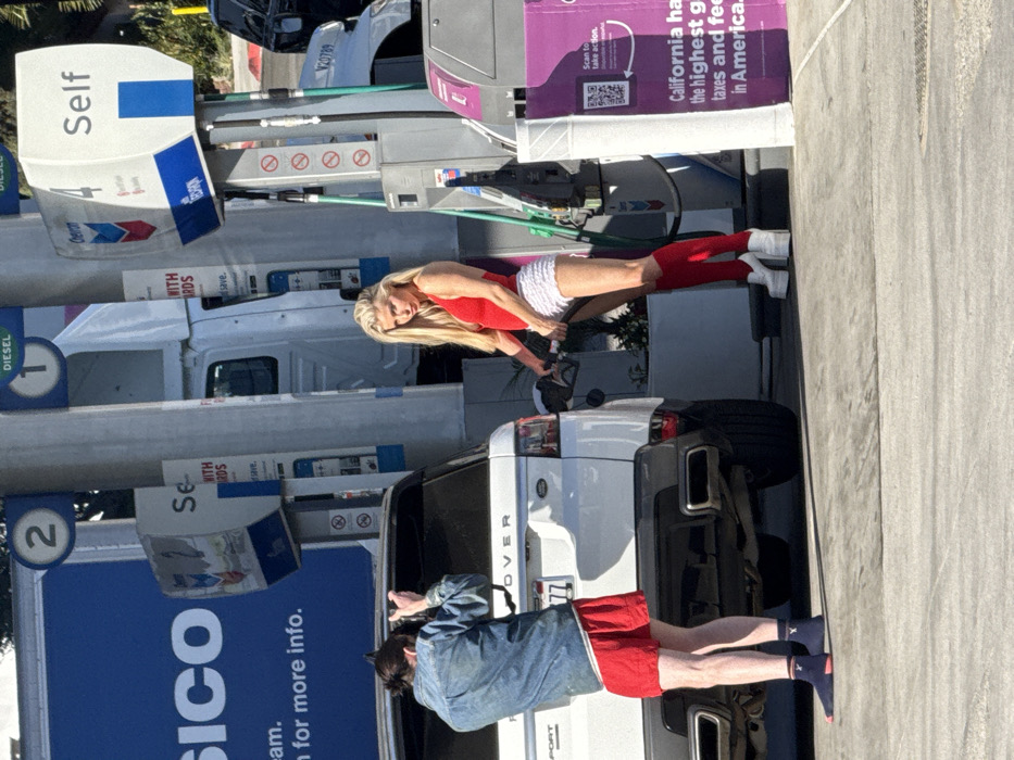 Woman spotted at West Hollywood Chevron with Range Rover