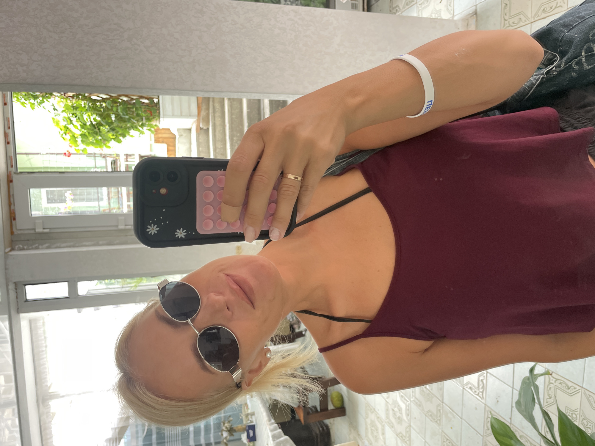Selfie session in a Gagra courtyard, bougainvillea in bloom
