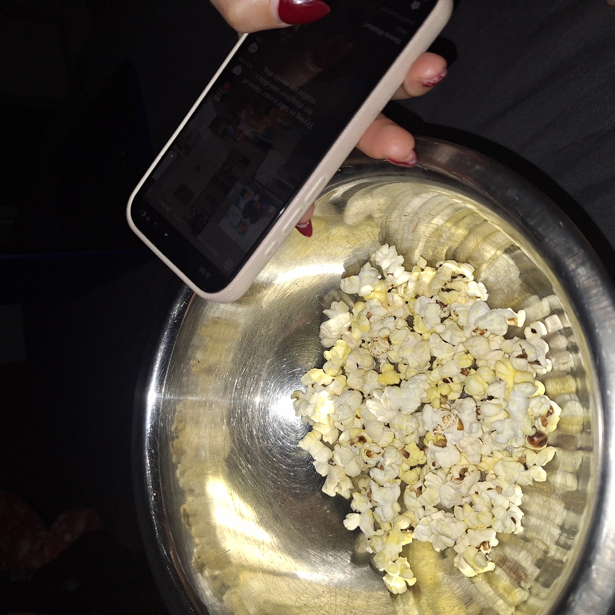 Person films popcorn bowl for social media in Vidin