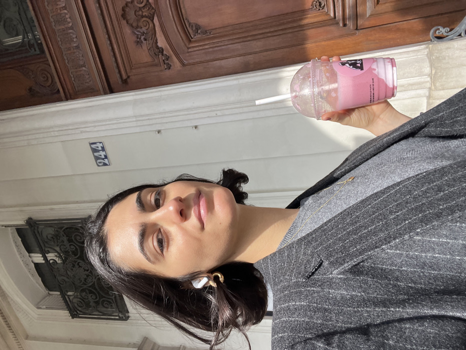 Woman takes selfies near Tuileries Garden in Paris
