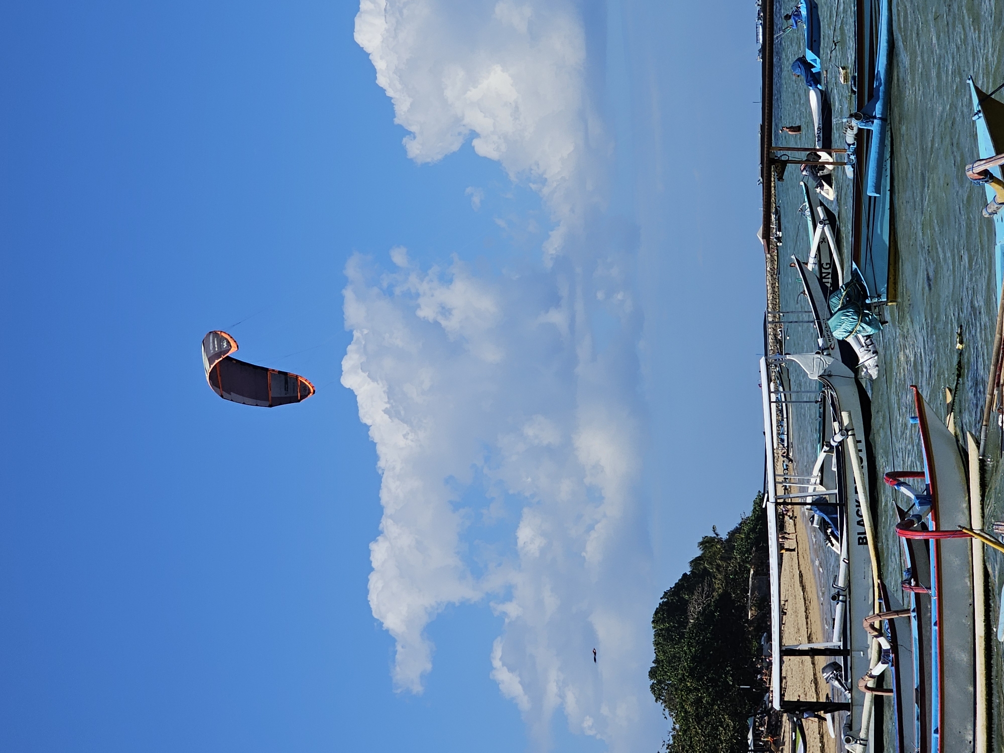 Boats, kites, and calm seas at Sanur beach